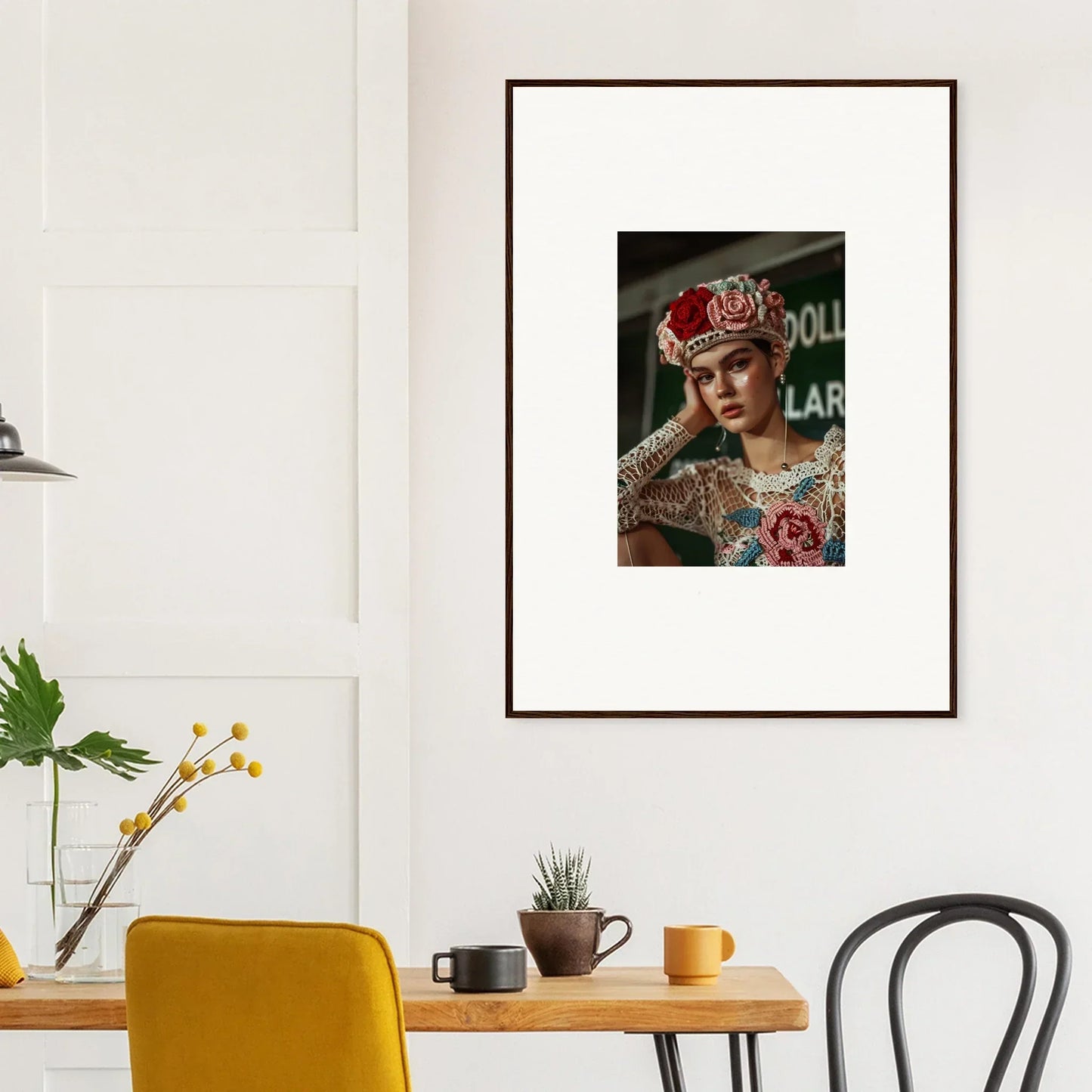 Framed portrait photograph of a person wearing an ornate headdress and colorful attire.