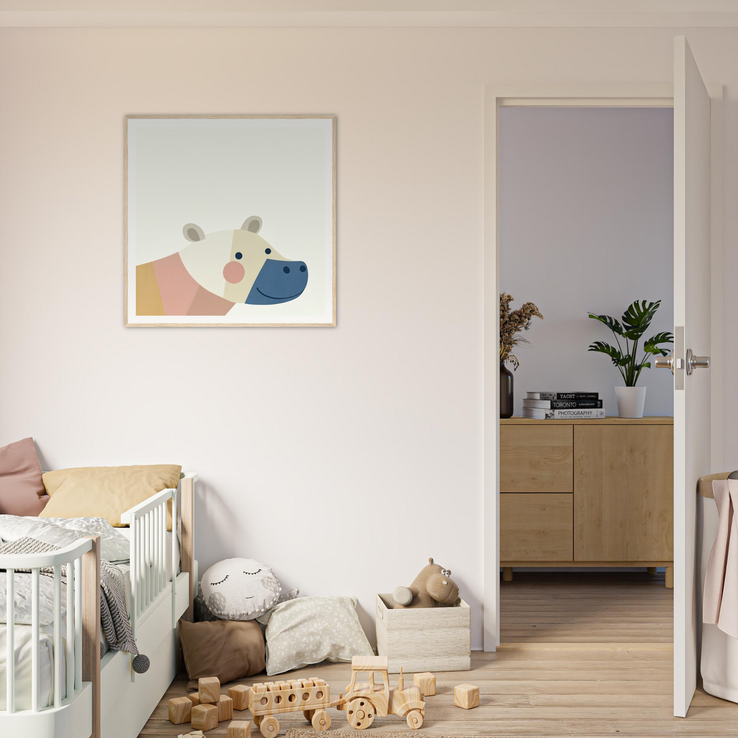 White wooden crib with curved railings perfect for nursery decor and framed posters