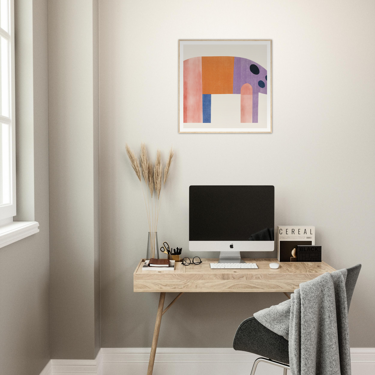 Minimalist wooden desk with iMac and nursery wall art above for stylish nursery decor