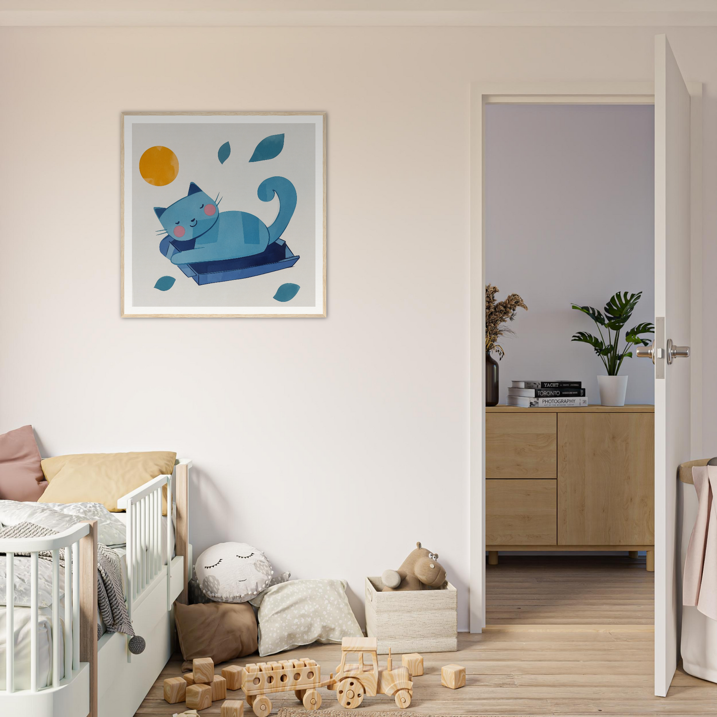 Framed poster of a blue cat lounging with leaves, perfect for nursery wall art