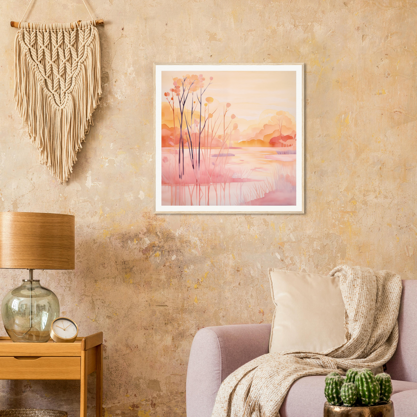 Cozy living room with pink armchair, macramé wall hanging, and nursery wall art