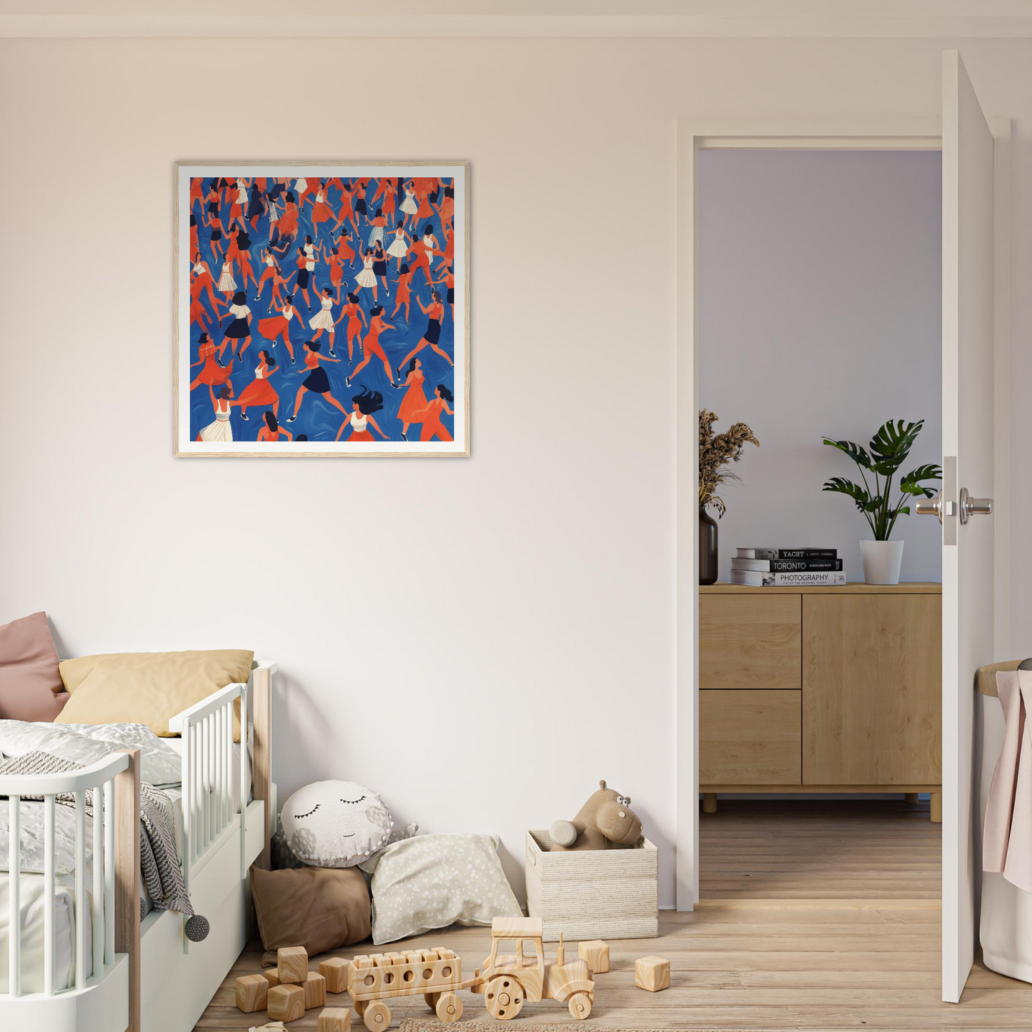 Framed abstract nursery wall art with red and blue figures in a crowd pattern for decor