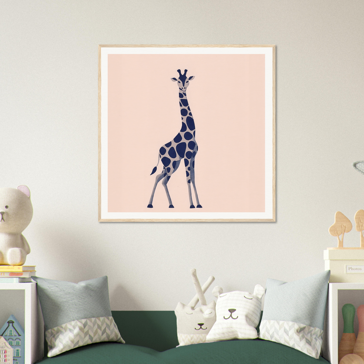 Navy blue giraffe silhouette for trendy nursery wall art on peachy-pink backdrop