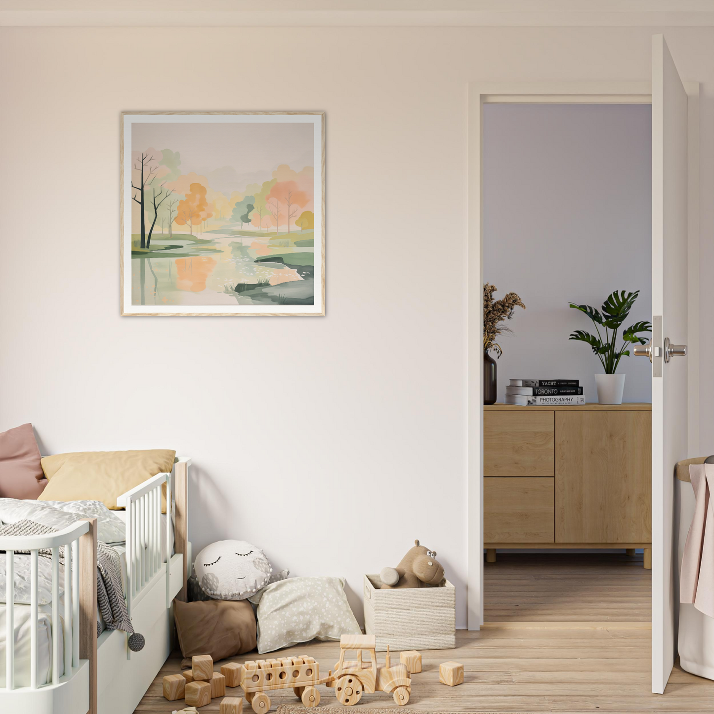 White wooden crib with curved railings, perfect for nursery decor and framed posters