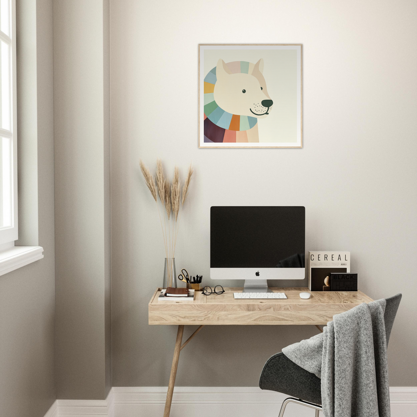 Minimalist wooden desk with iMac and colorful dog nursery wall art above it
