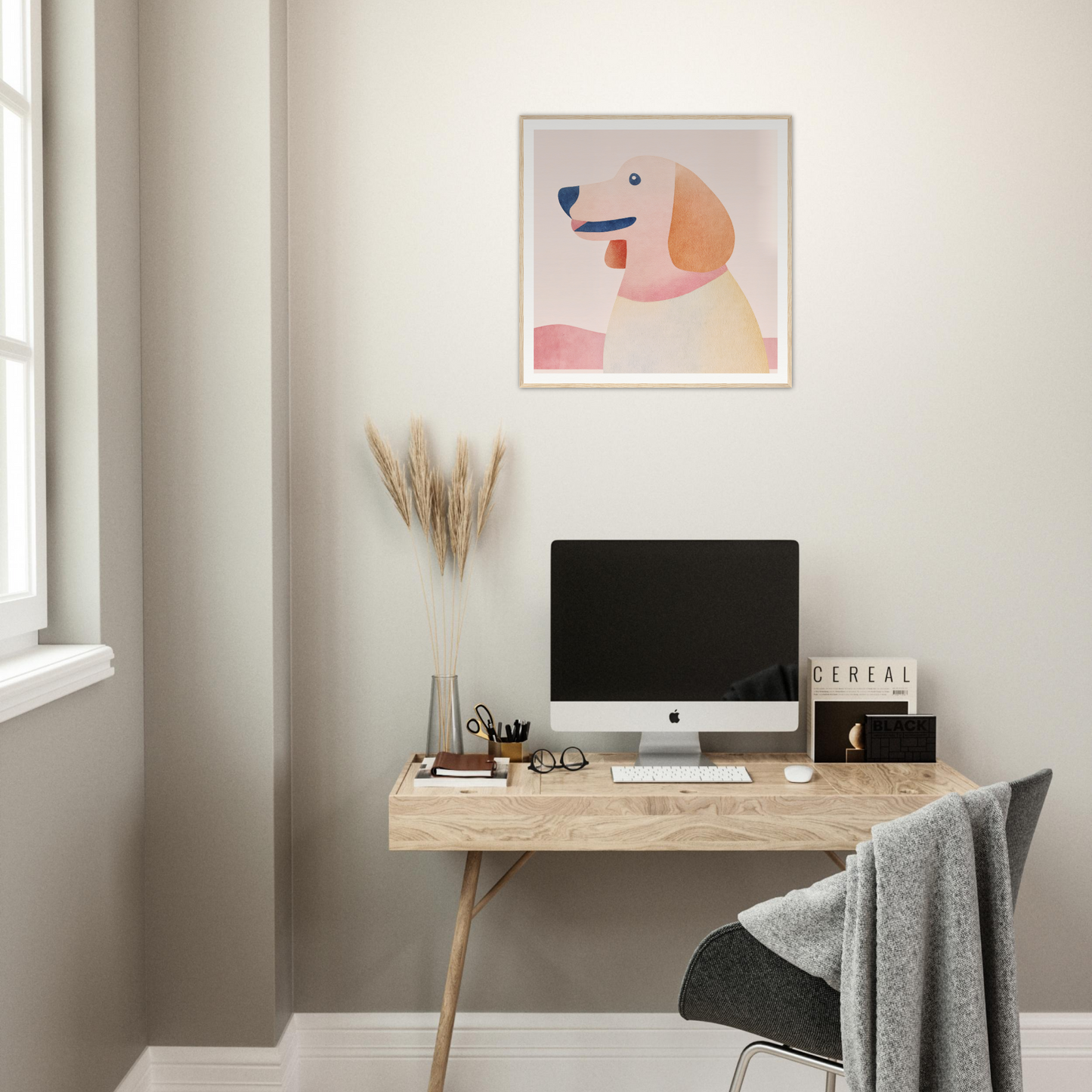 Minimalist wooden desk featuring an iMac and artwork above Psychedelic Pup Gregory