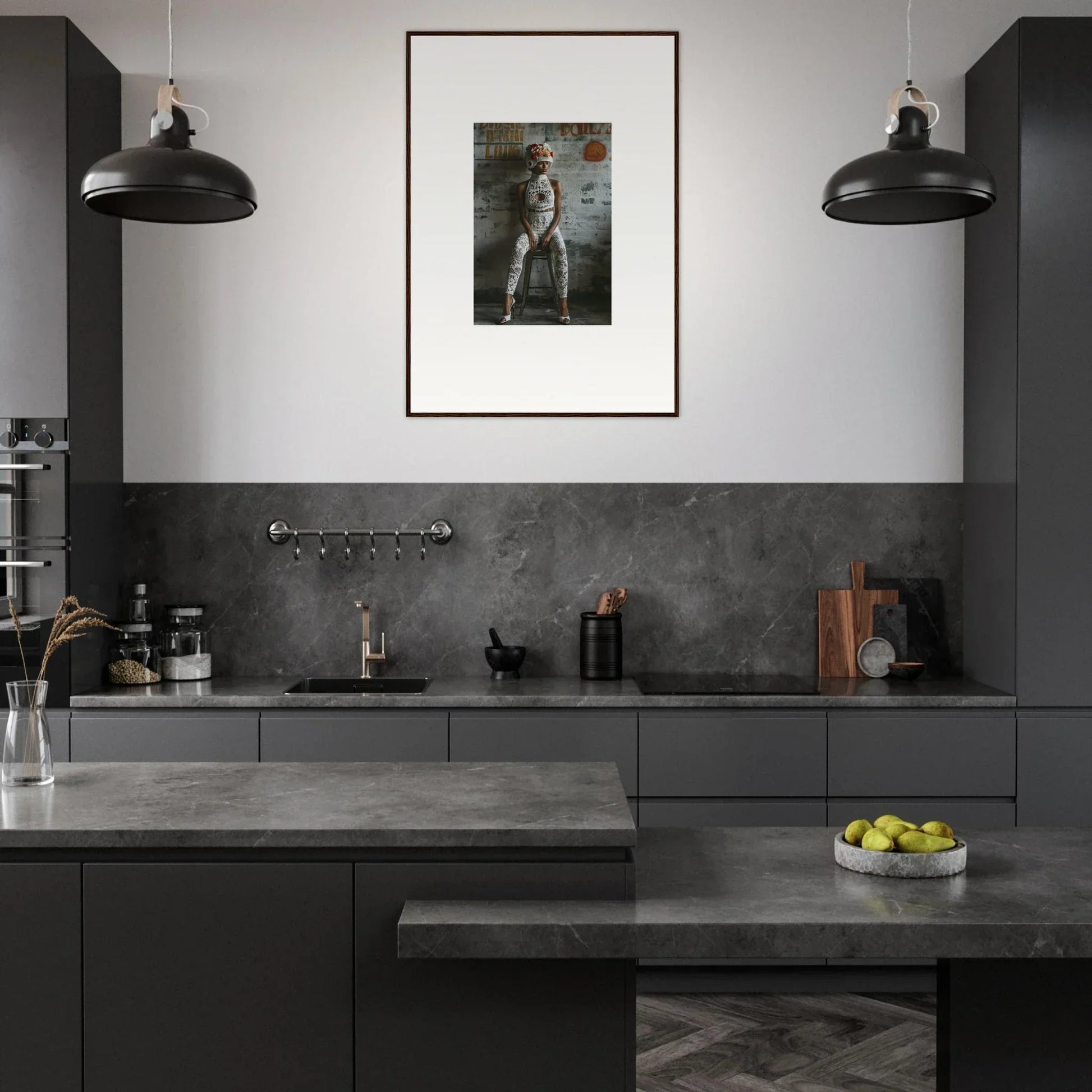 Modern kitchen with dark gray cabinetry, pendant lights, and framed wall art in Dream Loom