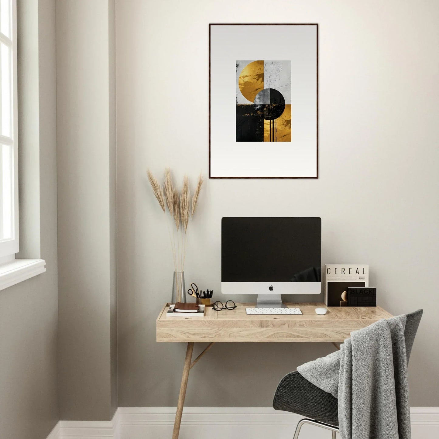 Minimalist home office with wooden desk, computer, and framed wall art for golden dreams