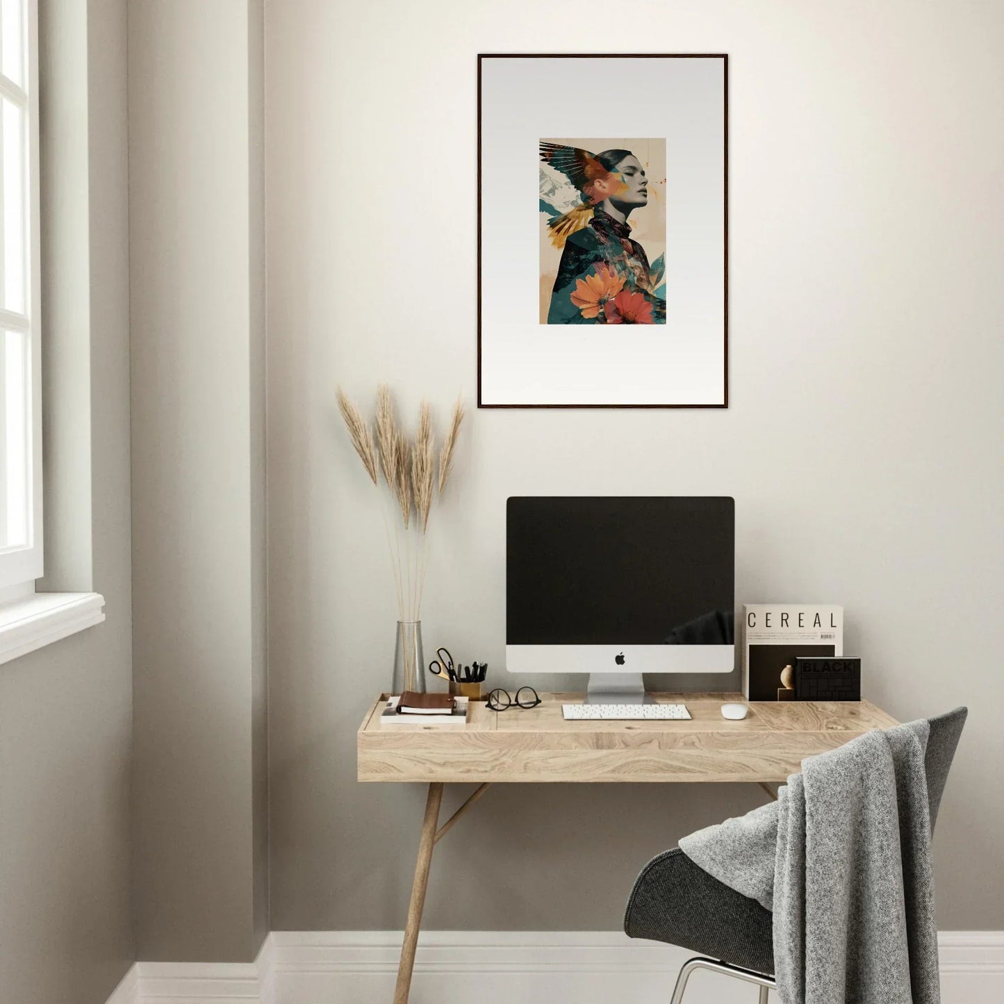 Minimalist wooden desk with computer monitor and framed wall art for stylish room decor