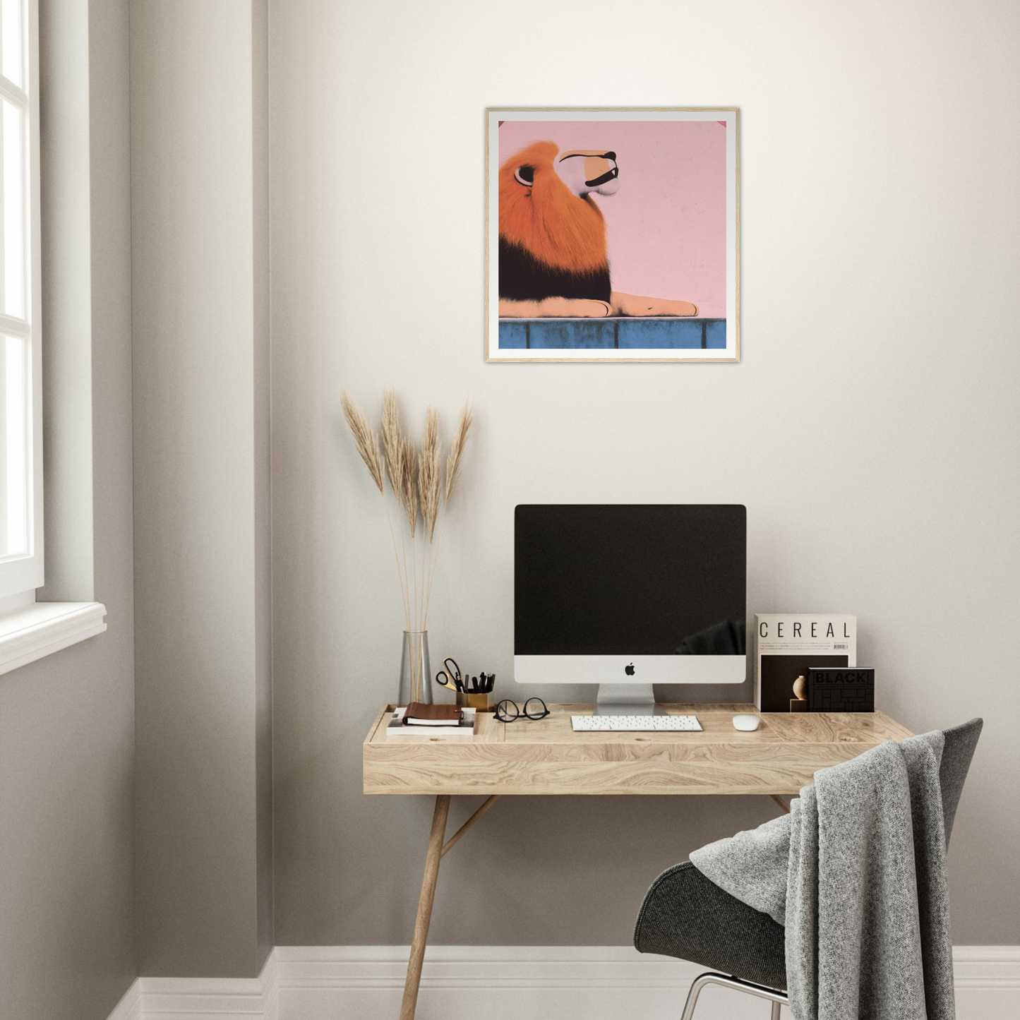 Simple wooden desk with iMac and minimal accessories showcasing Regal Tranquil Spectacles