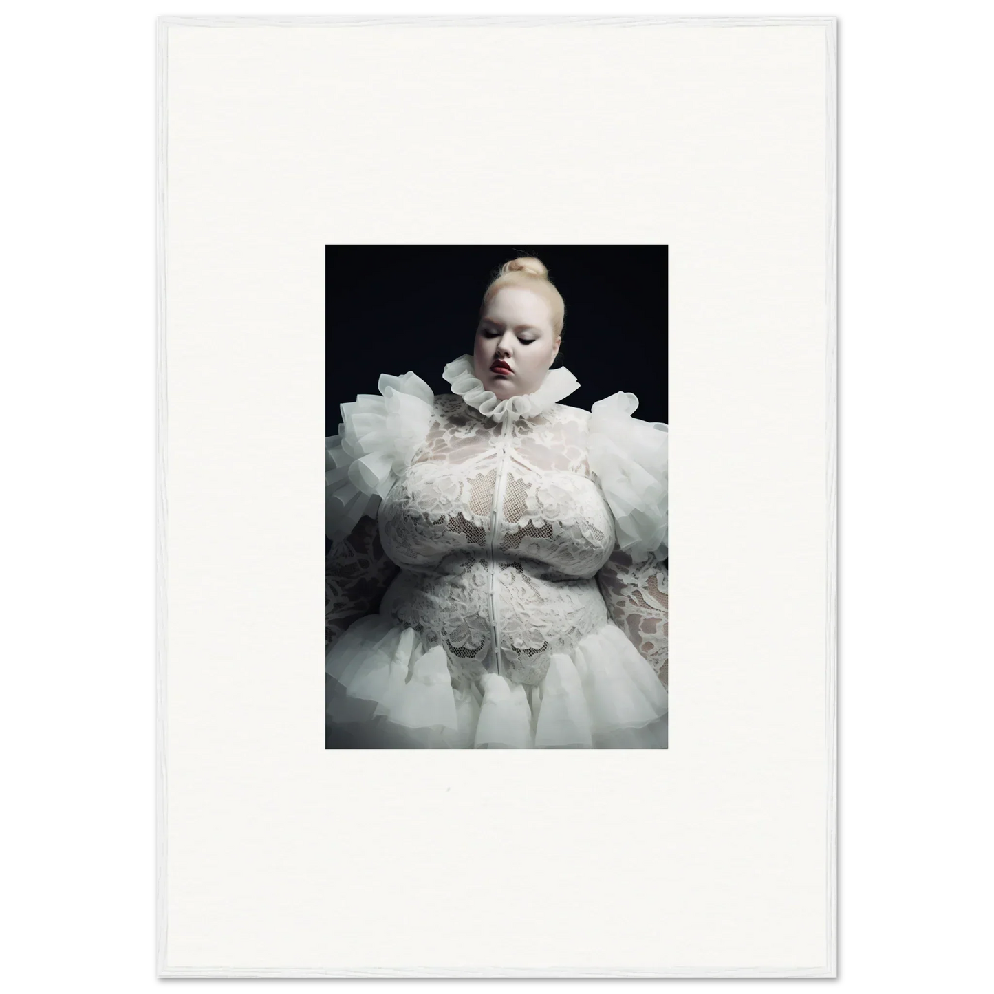 Infant wearing an elaborate white lace and ruffled christening gown.