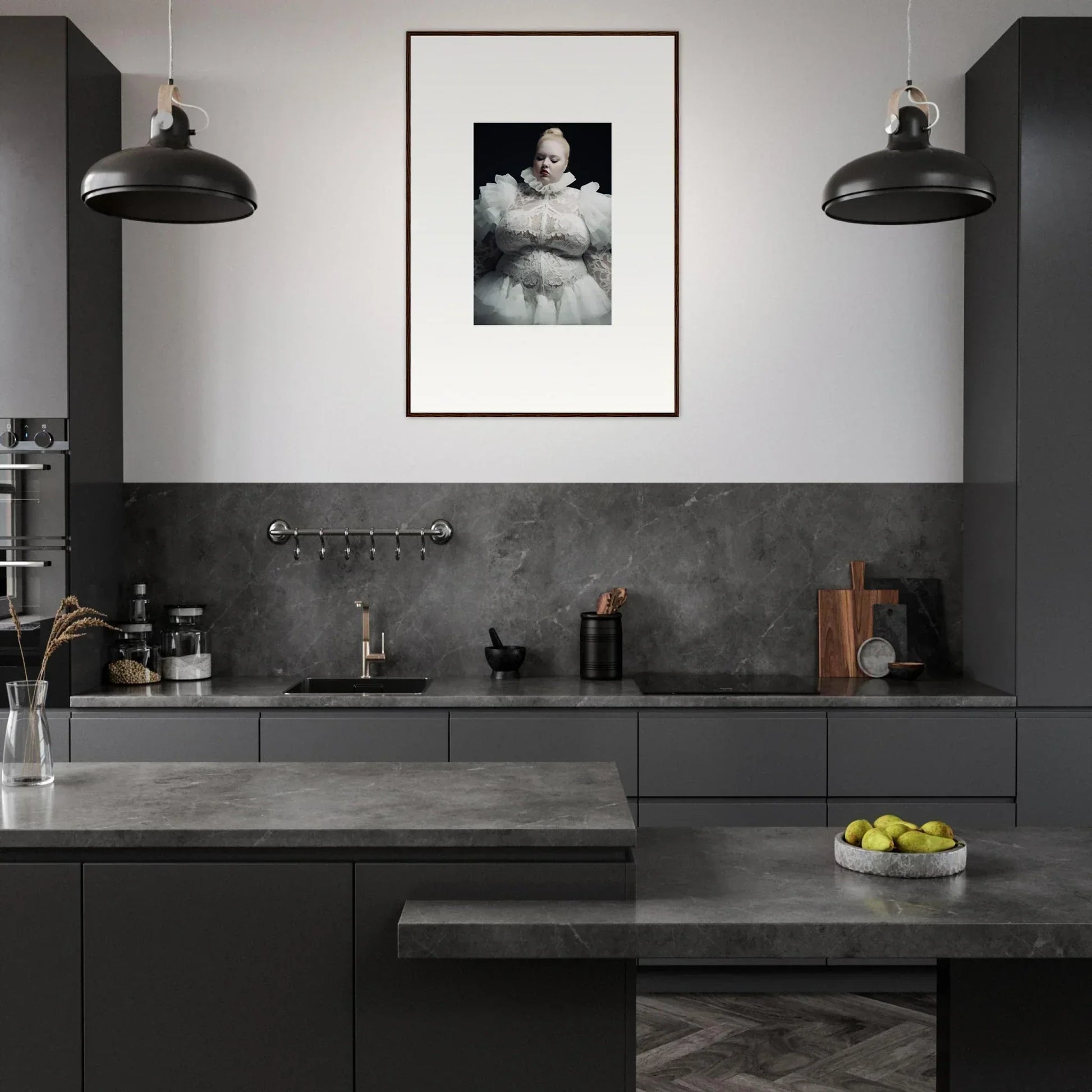 Modern, sleek kitchen with dark cabinetry and a framed black-and-white photograph on the wall.