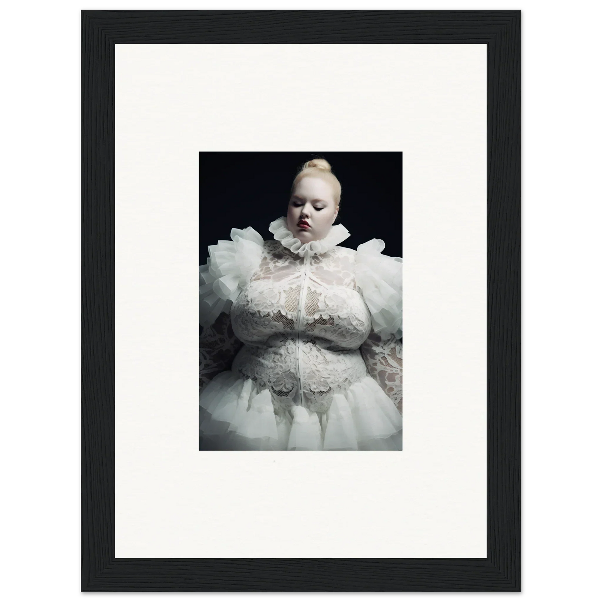 Framed photograph of a figure wearing an elaborate white ruffled costume against a dark background.