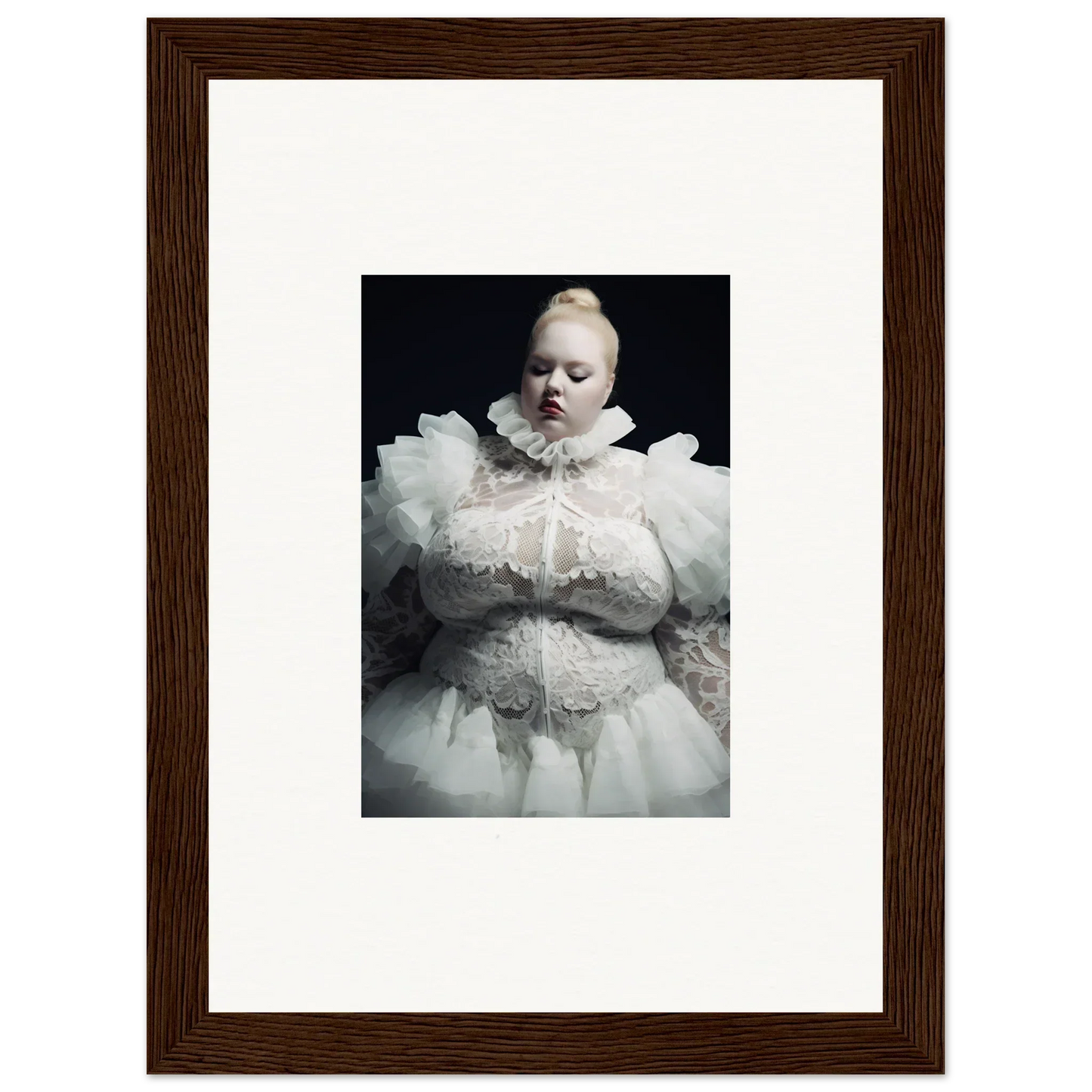 Framed photograph of a baby wearing an elaborate white christening gown.