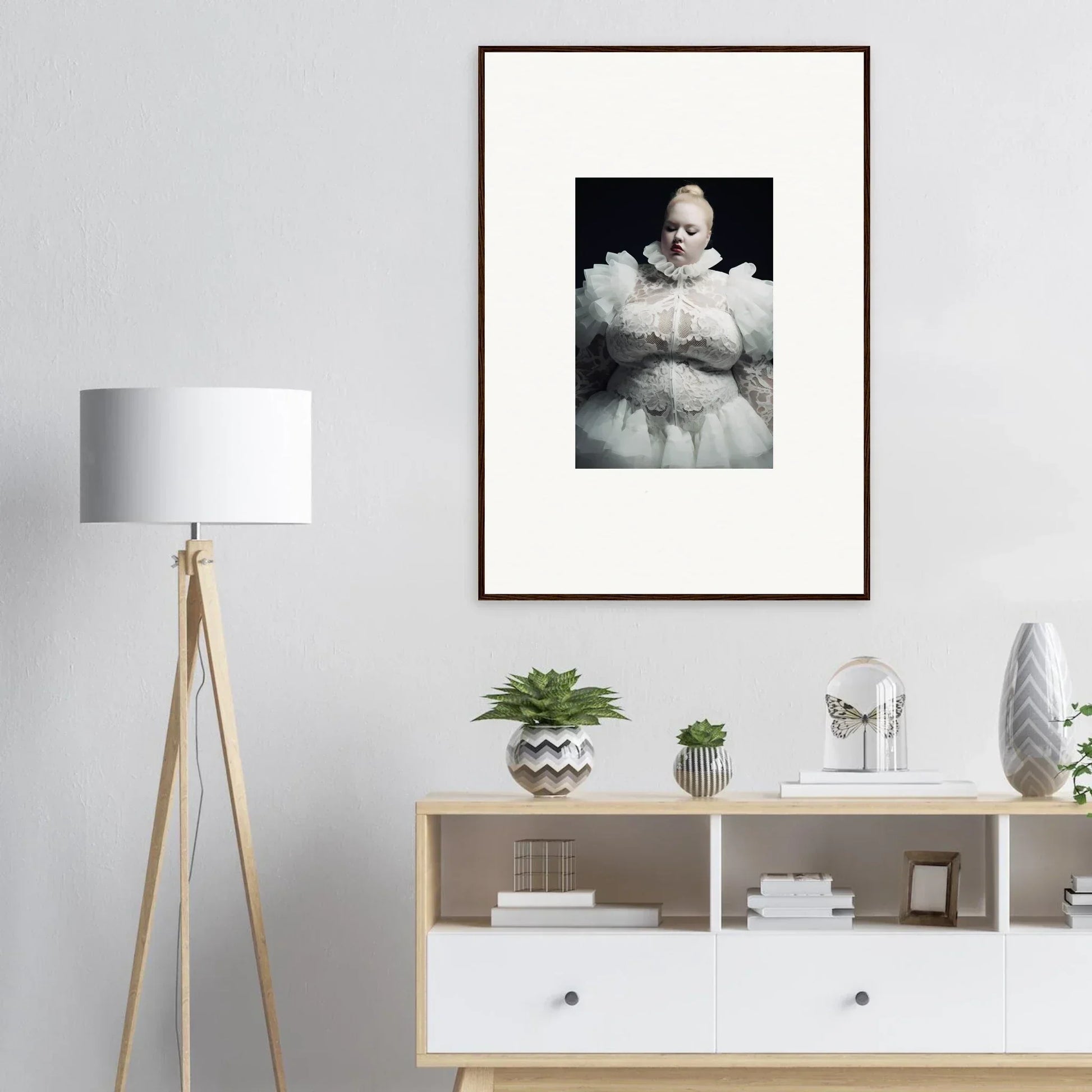 Framed black and white photograph of a person wearing a puffy white outfit.