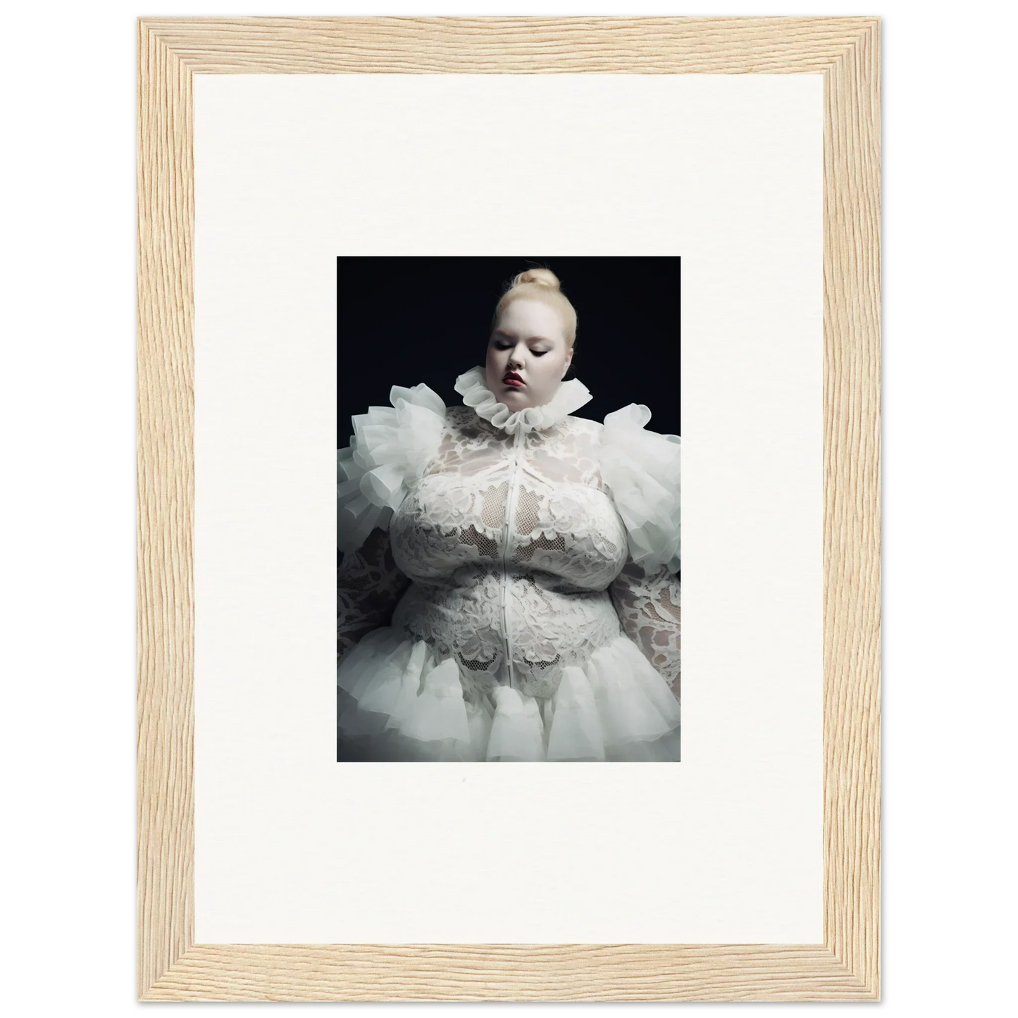 Portrait photograph of a figure wearing an elaborate white ruffled costume against a dark background.