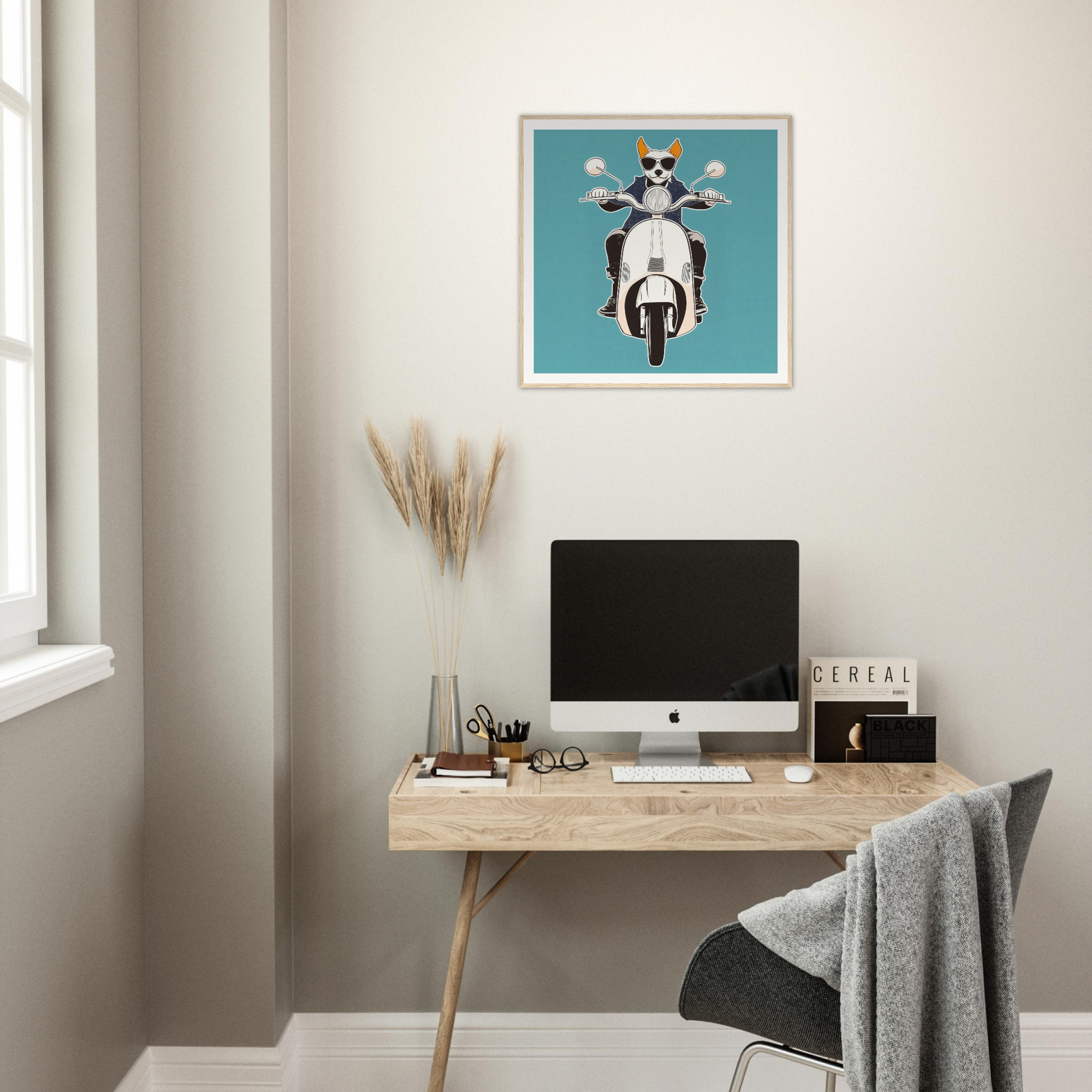 Minimalist home office featuring iMac and Scooter Canine Voyage artwork on wall