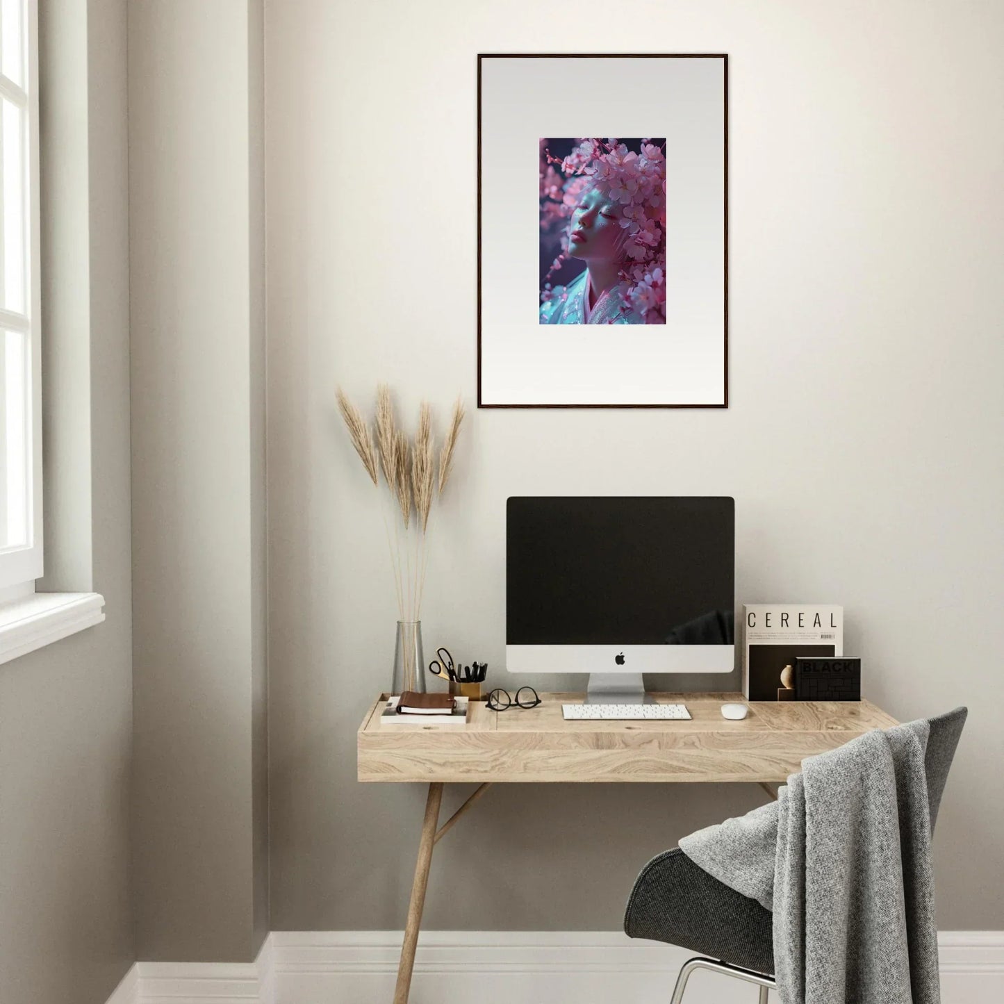 Minimalist home office with wooden desk, computer, and Serenity Blossoms Vulgarity art