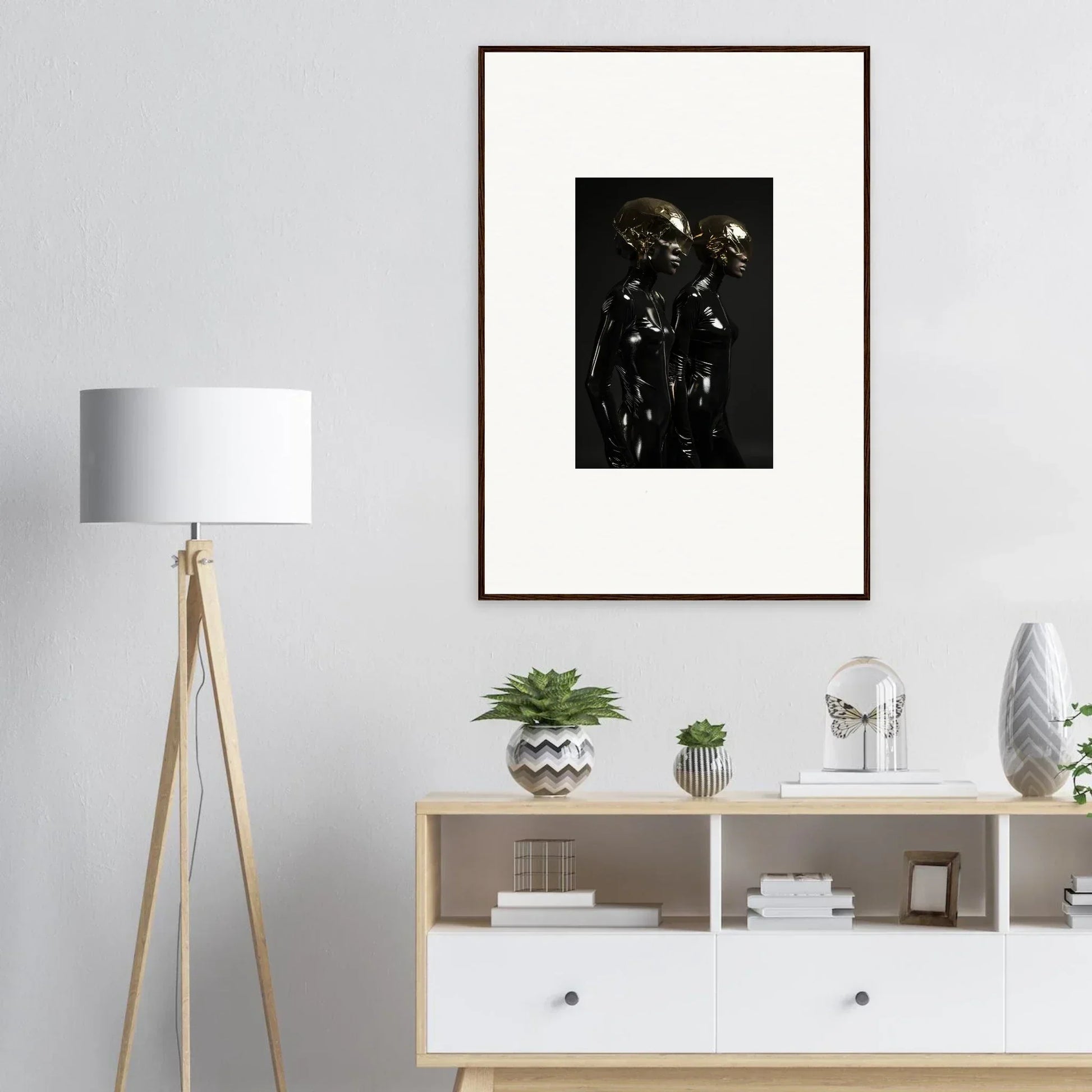 Framed black and white photograph depicting shadowy figures against a dark background.