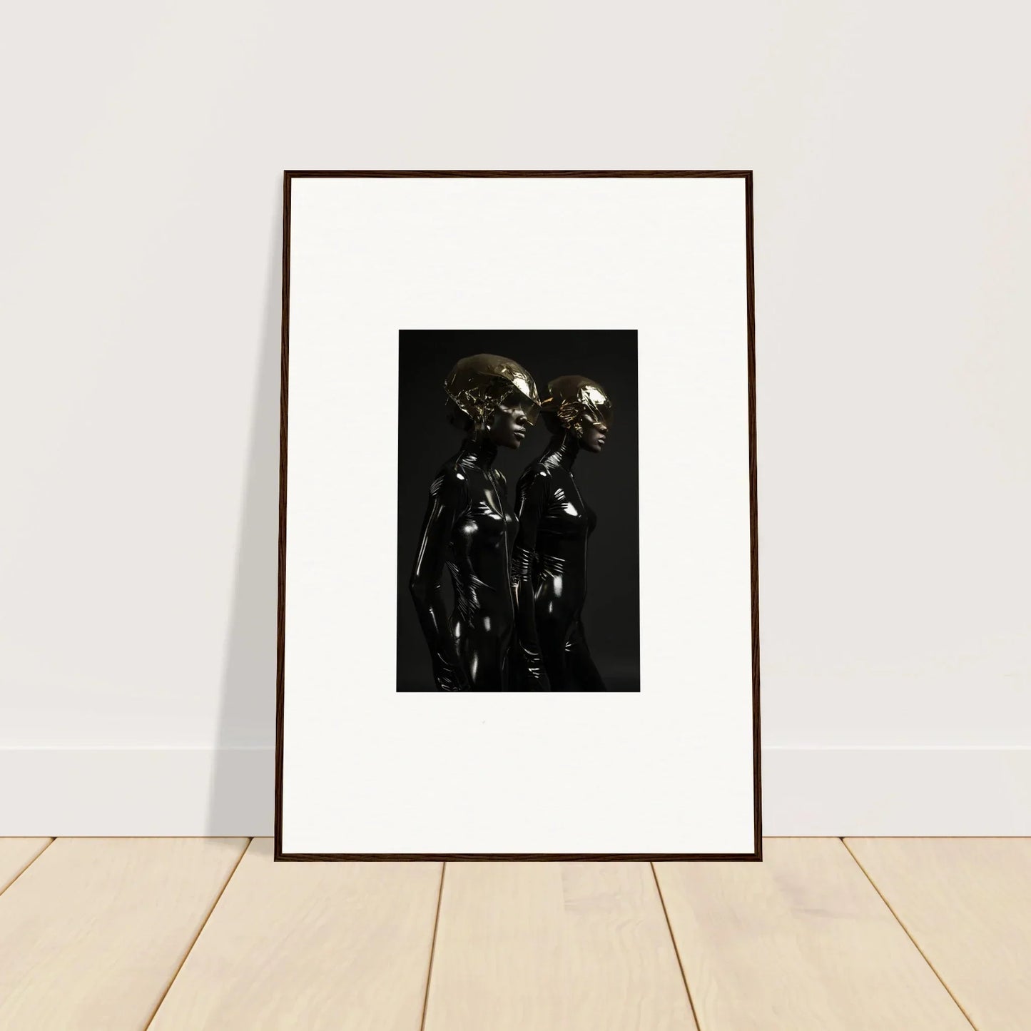 Framed black and white photograph of two figures in metallic-looking suits or armor.
