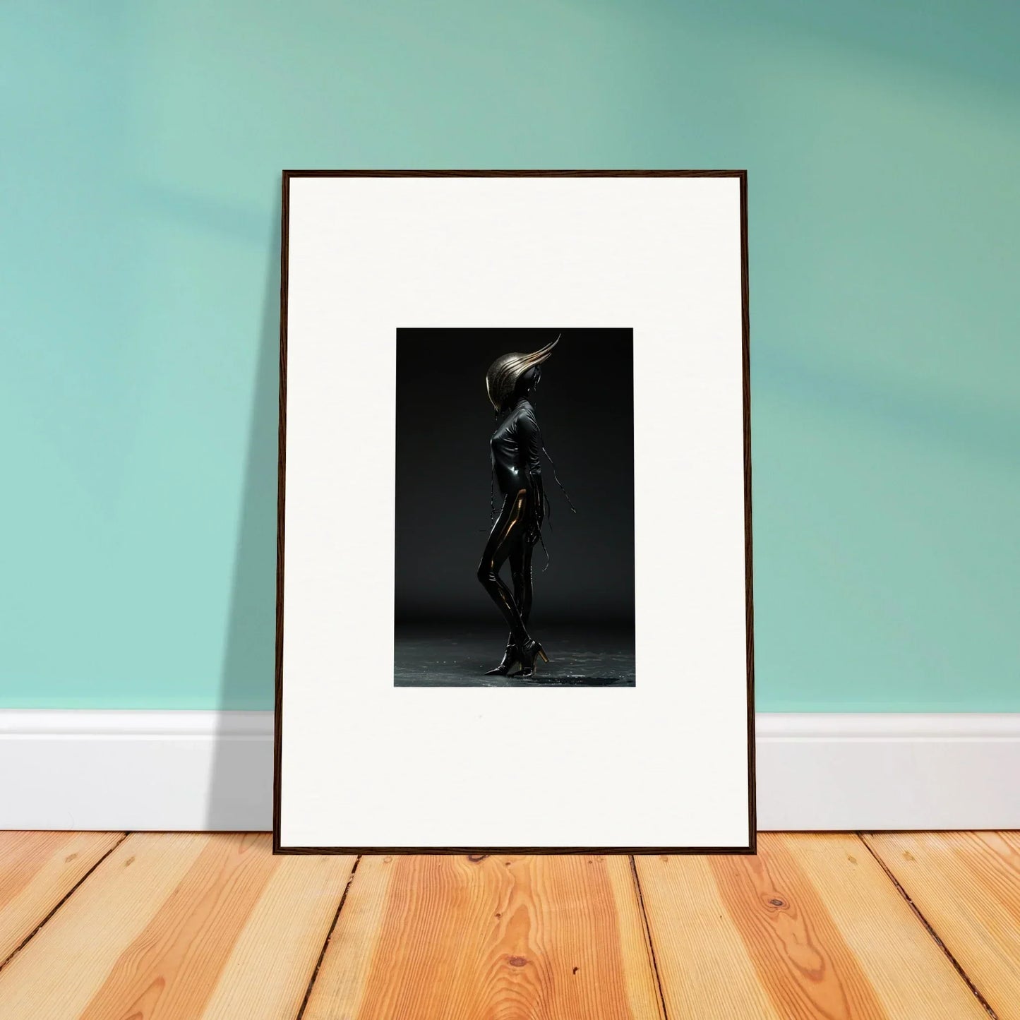 Framed black-and-white photograph of a figure in a dramatic pose.