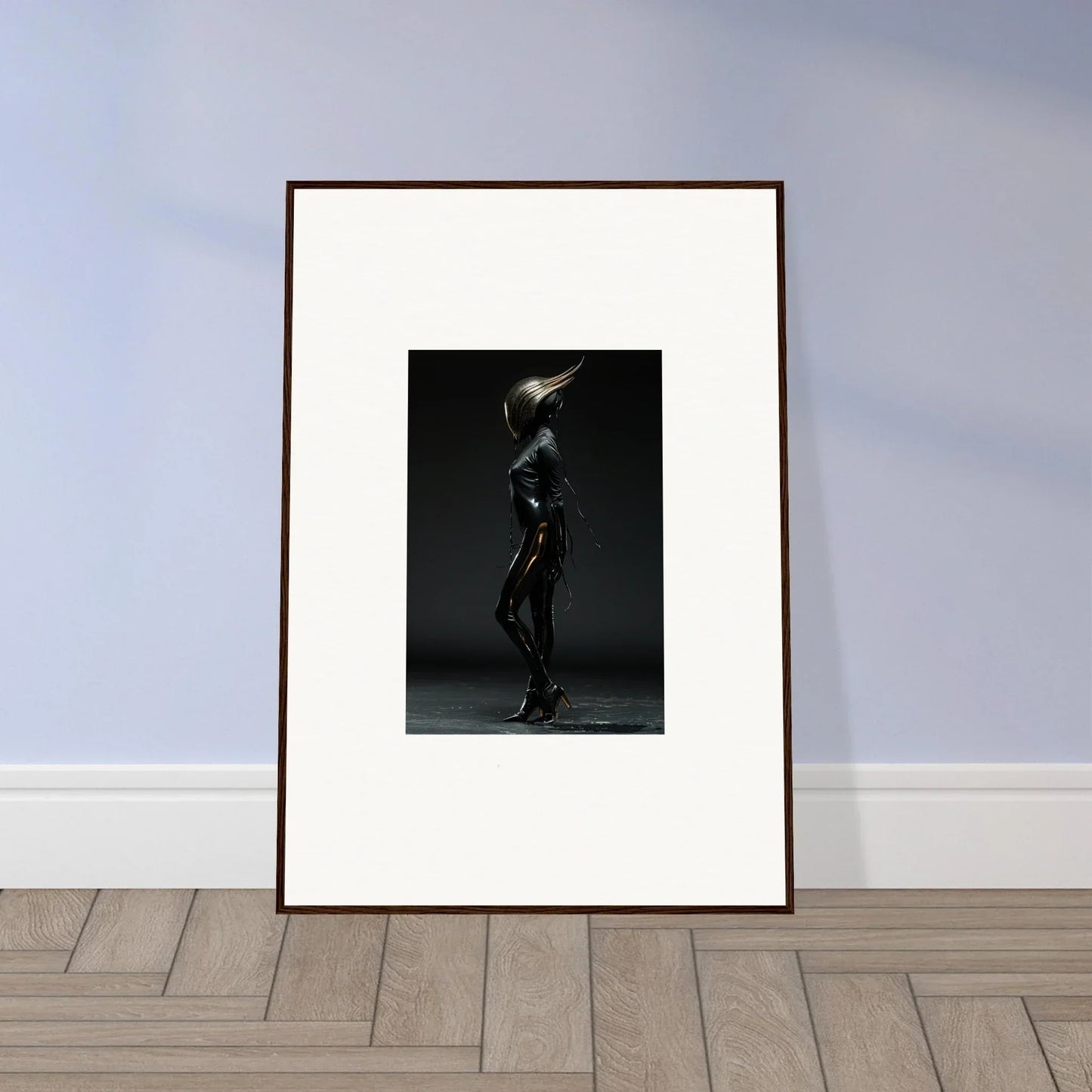 Framed black-and-white photograph of a sleek, metallic humanoid figure in a dynamic pose.