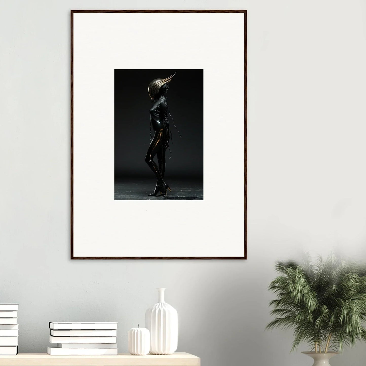 Framed black and white photograph of a nude figure in a dramatic pose.