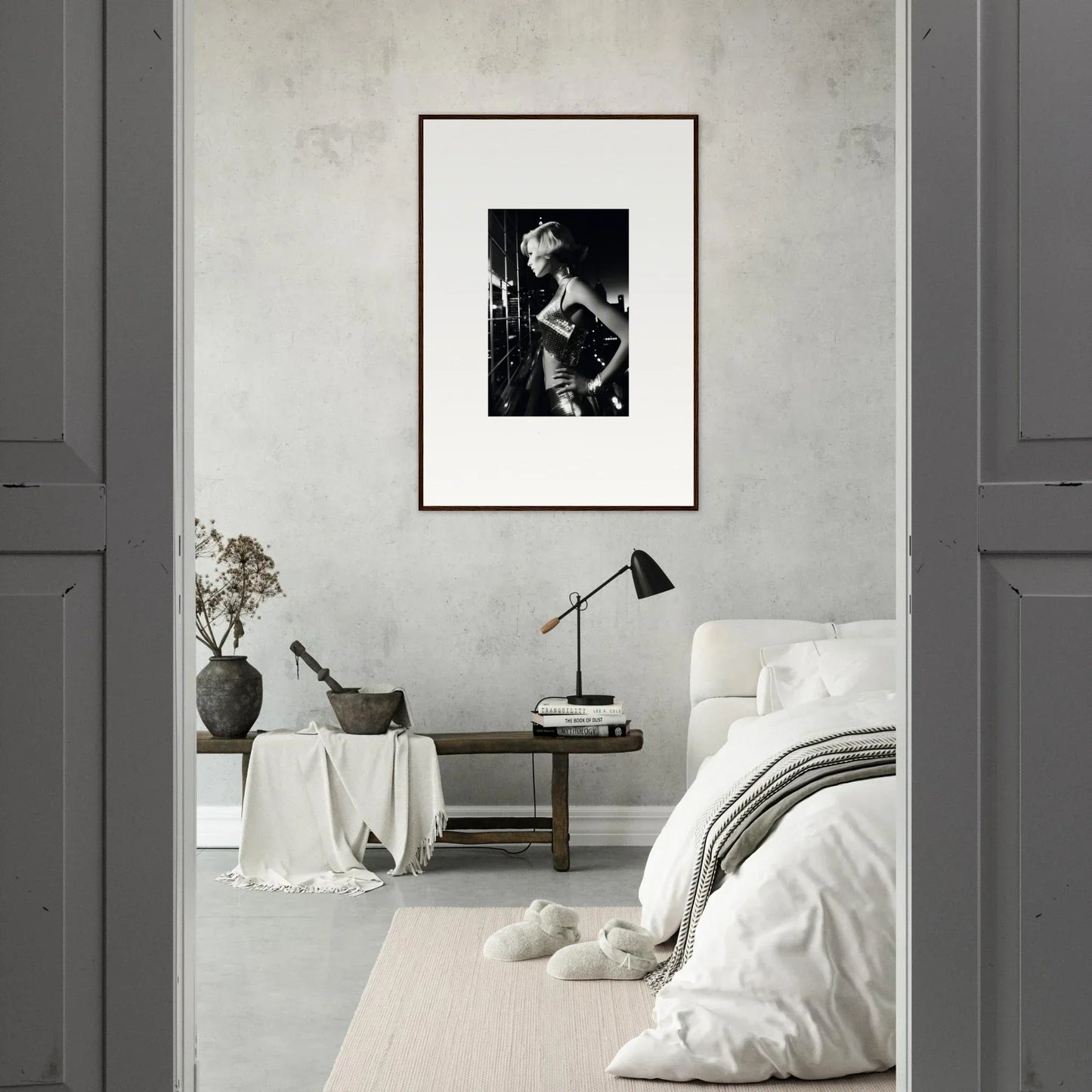Framed black and white photograph hanging on a light-colored wall.