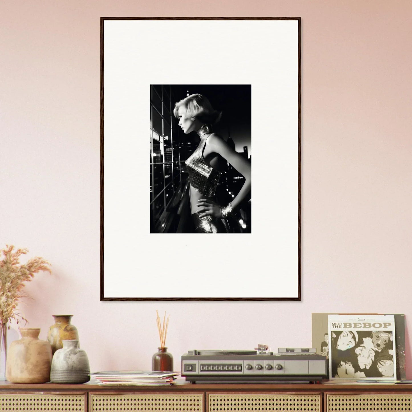 Framed black and white photograph of a woman in a glamorous pose.