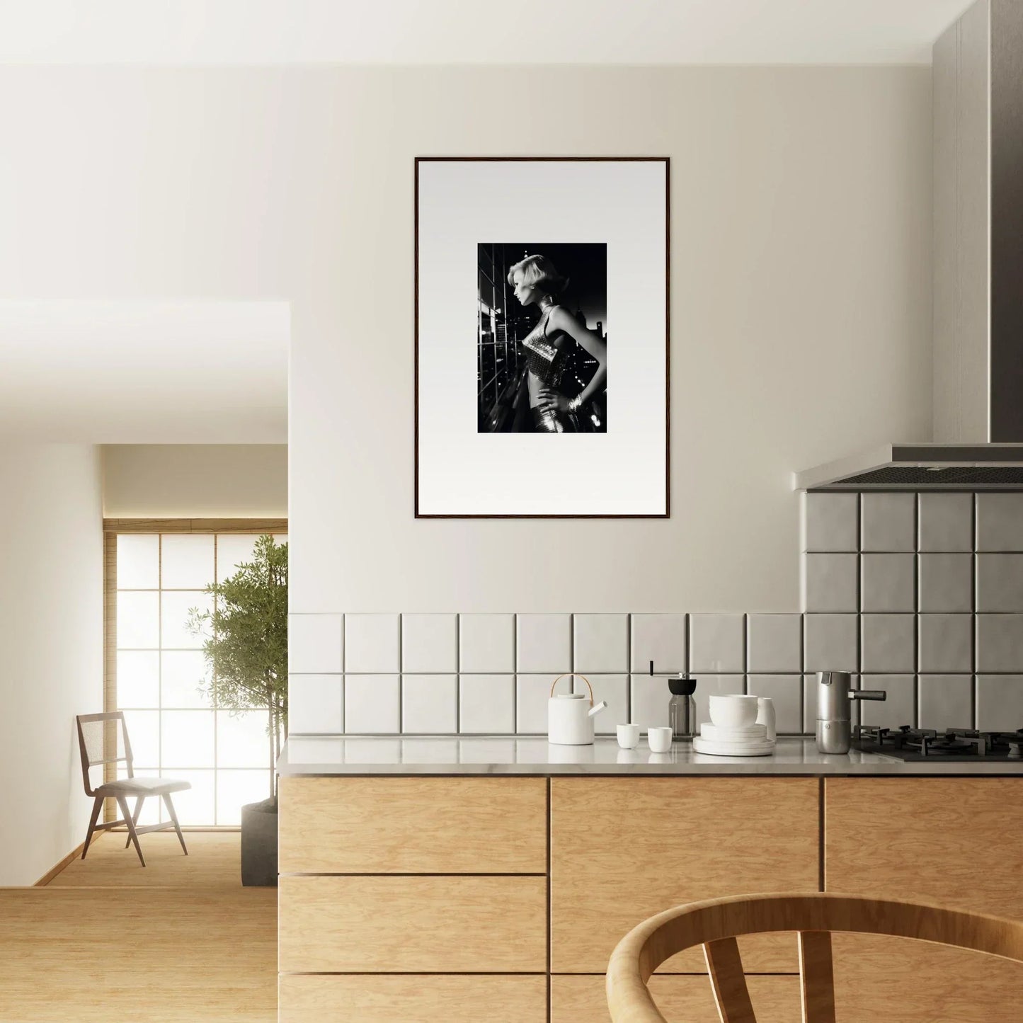 Framed black and white photograph hanging on a kitchen wall.