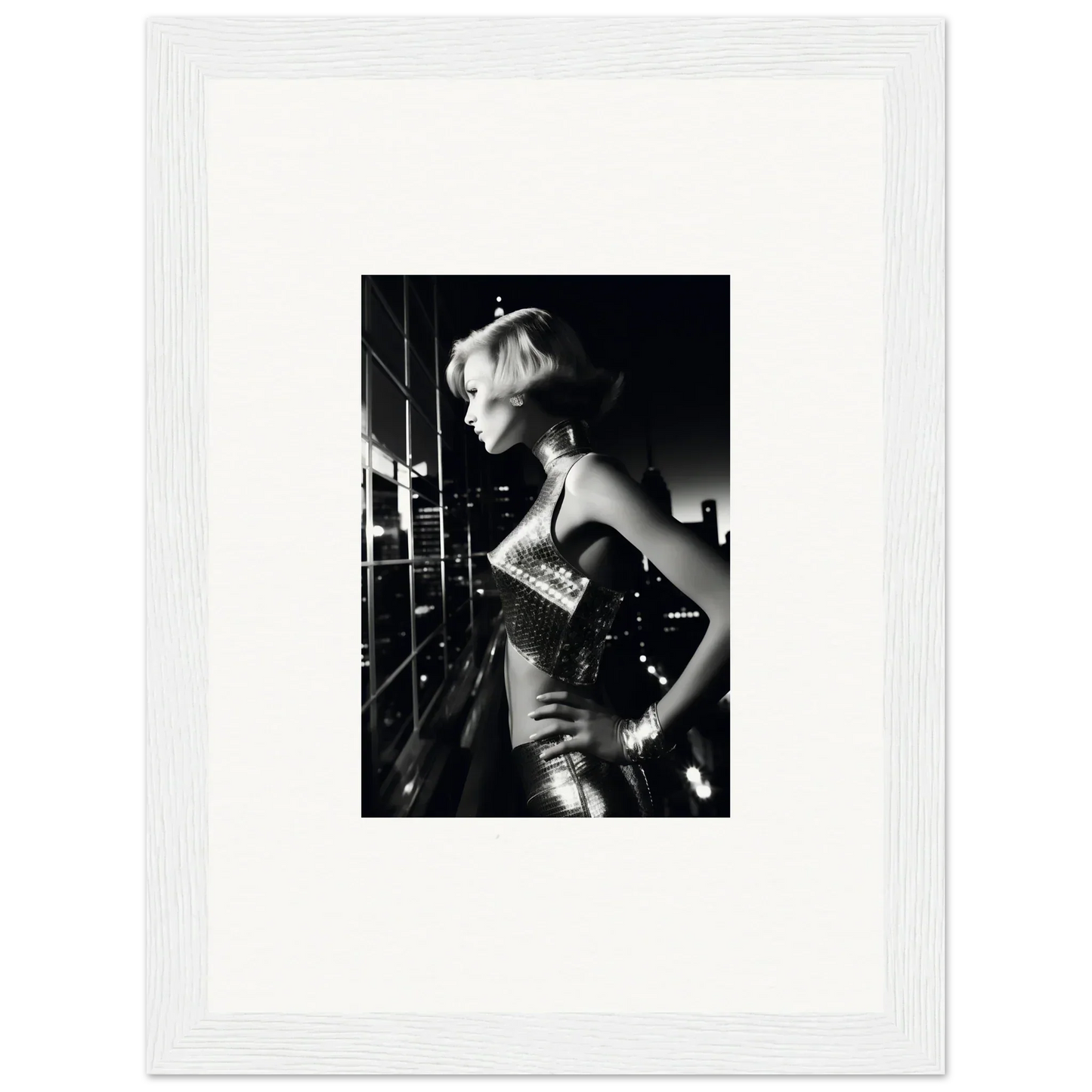 Black and white photograph of a woman in a sparkly dress with short blonde hair.