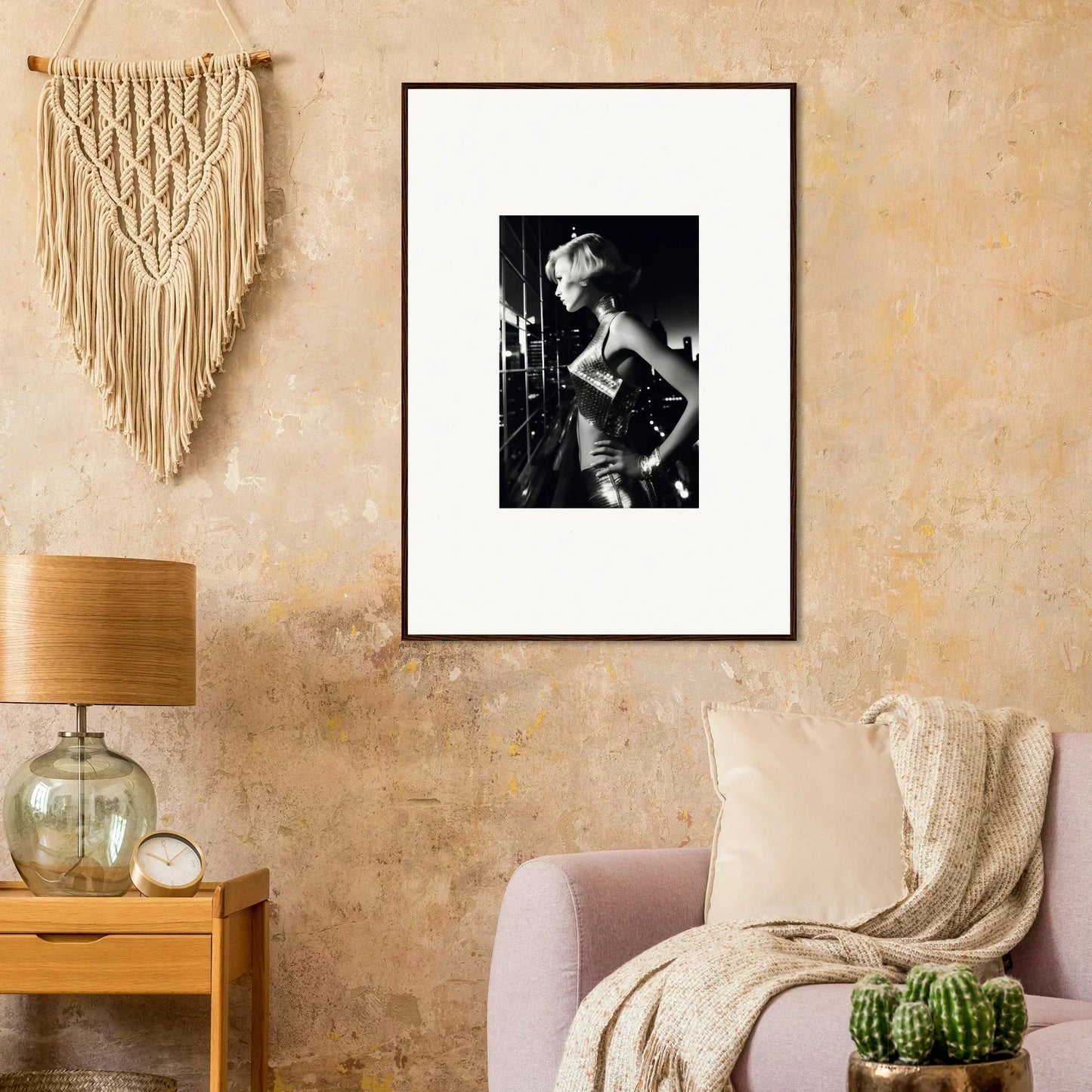 Framed black and white photograph of a person in a glamorous pose.