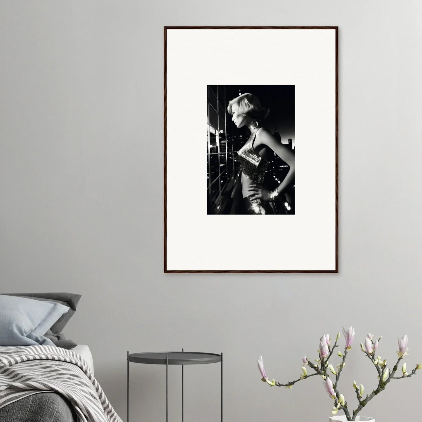 Framed black and white photograph of a person in a glamorous pose.