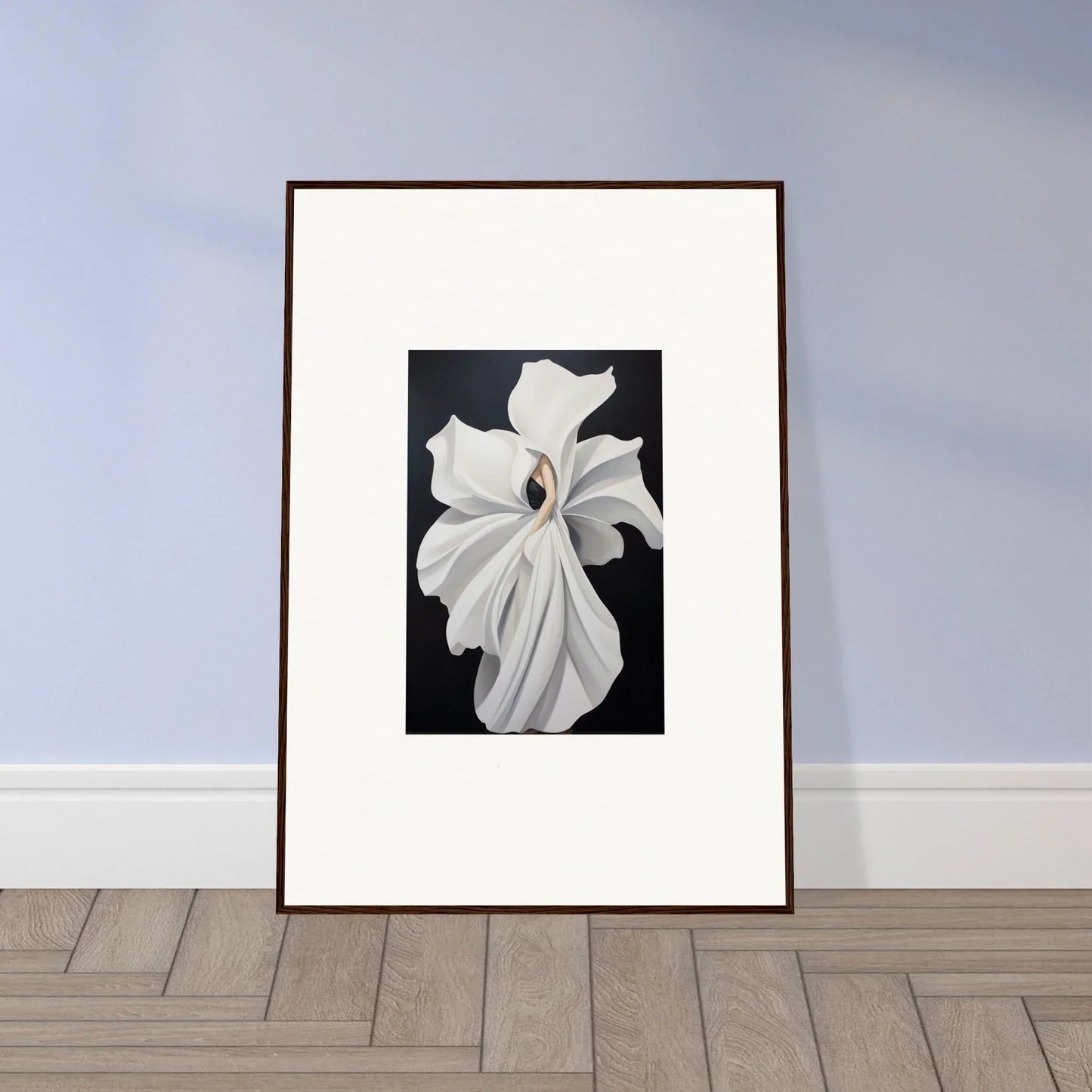 Framed wall art of a white flower showcasing petal fluidity on a dark background
