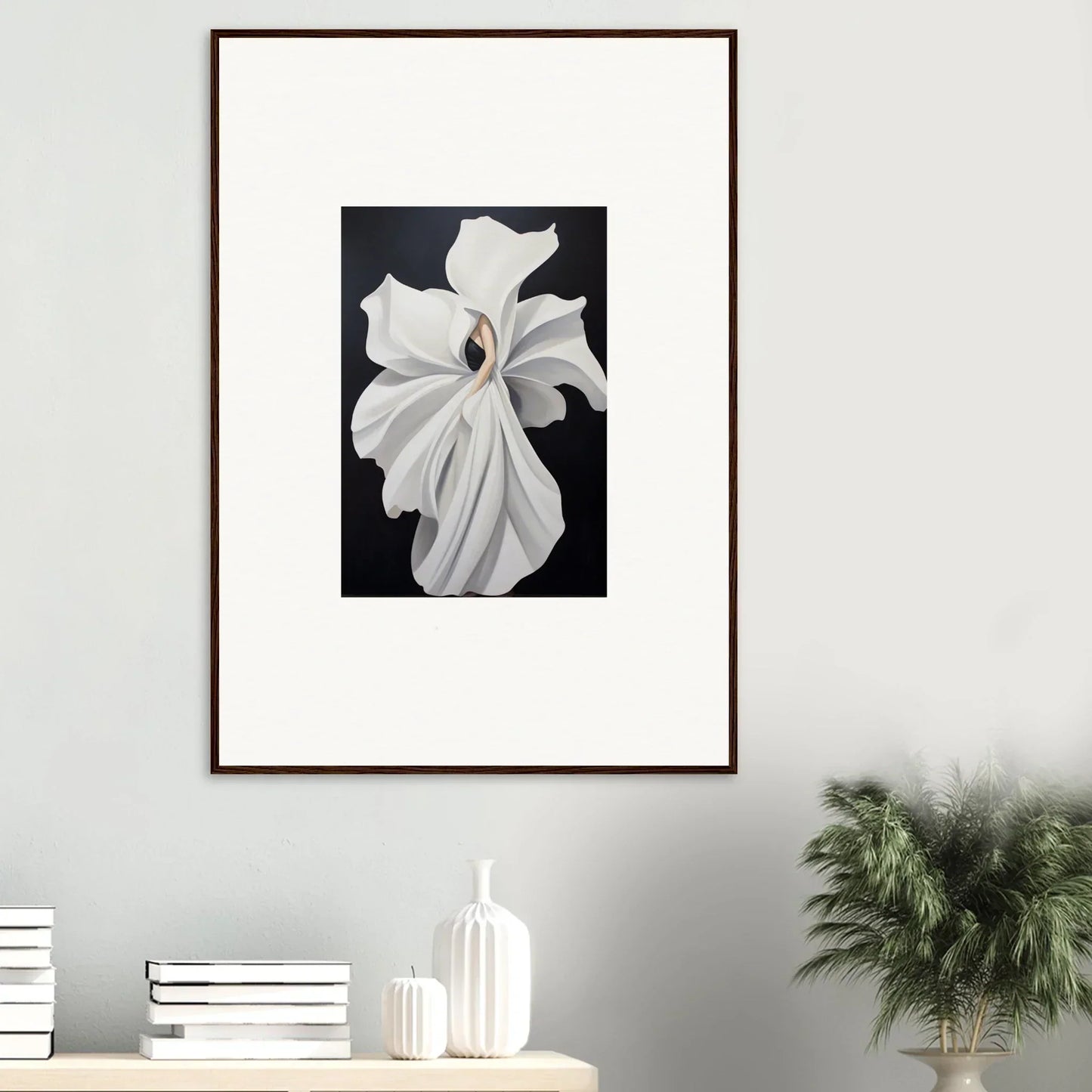 Framed wall art of a white orchid showcasing petal fluidity on a dark background
