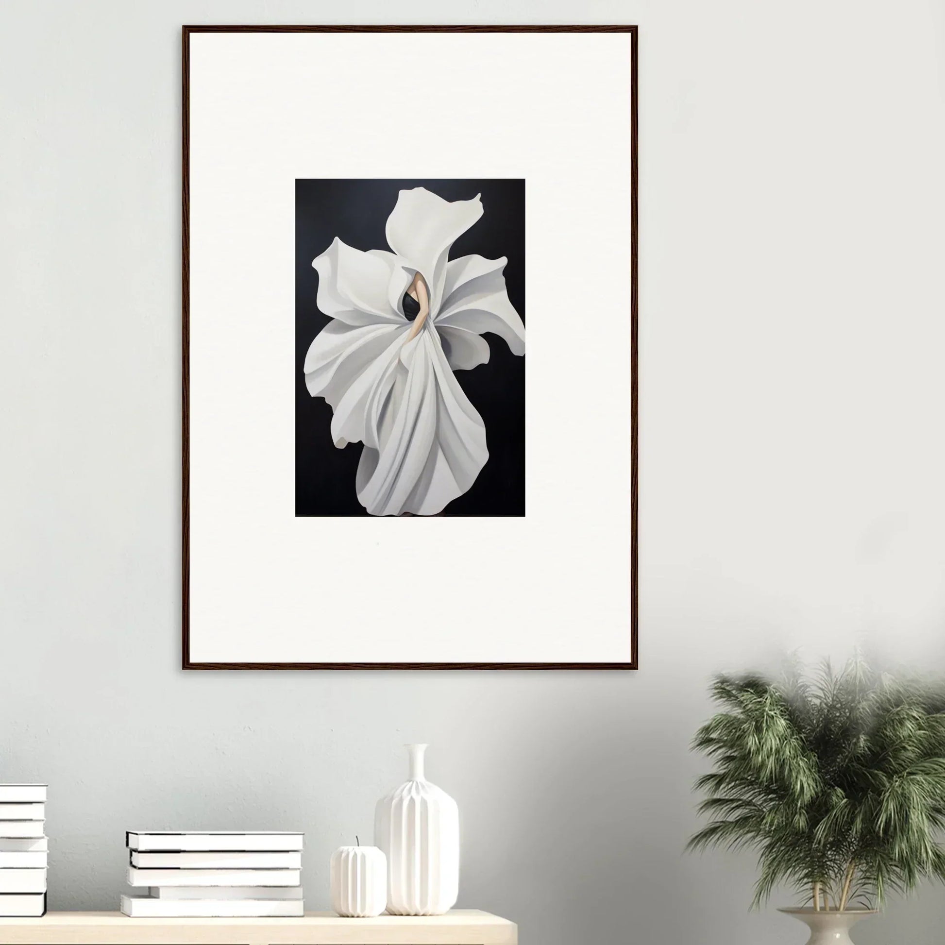 Framed wall art of a white orchid showcasing petal fluidity on a dark background