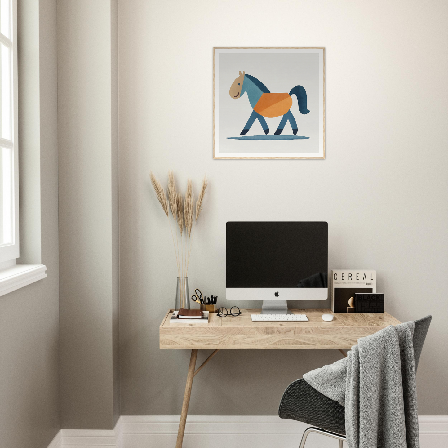 Minimalist wooden desk with iMac and Tranquil Trotting Majesty artwork above