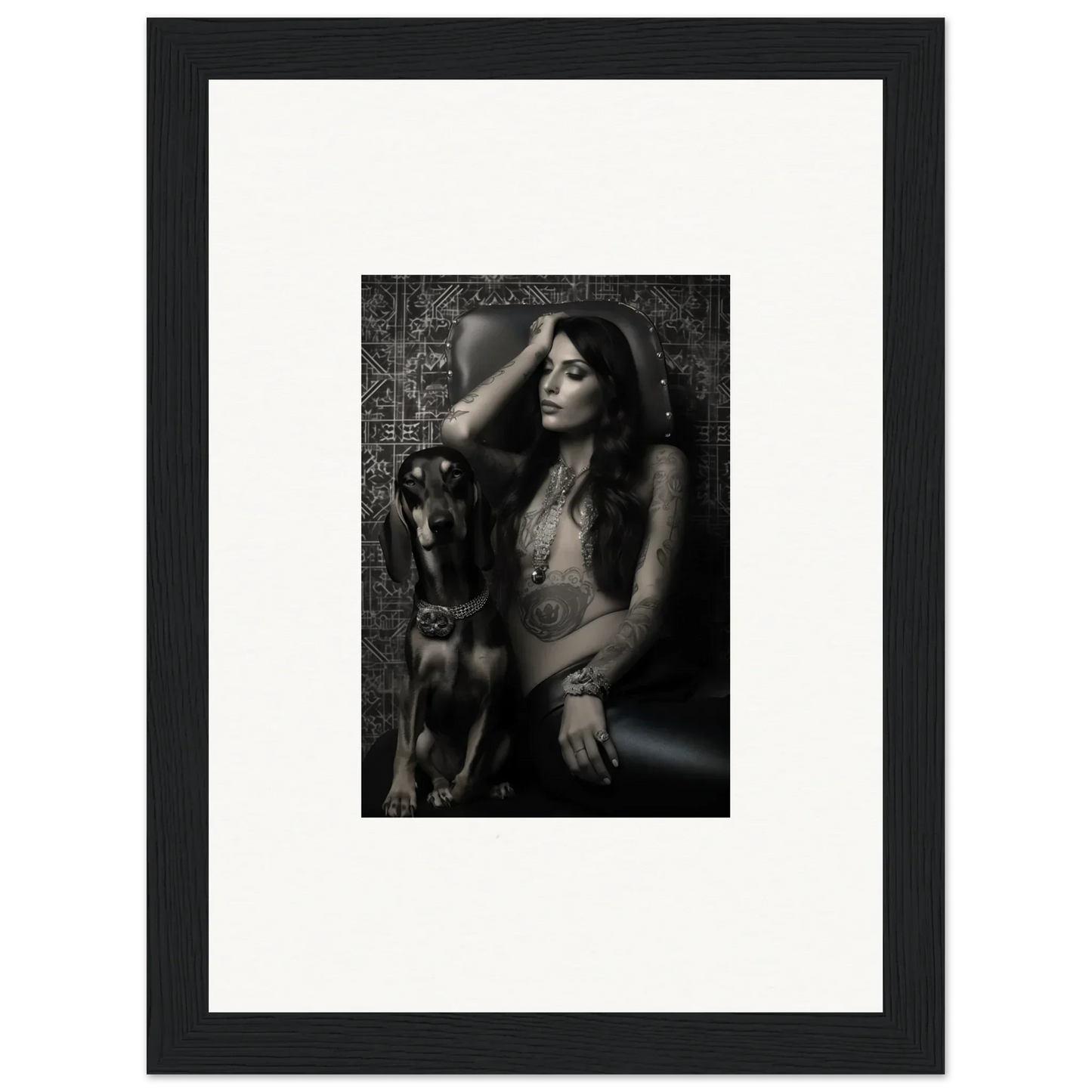 Framed black and white photograph of a woman posing with a dog.