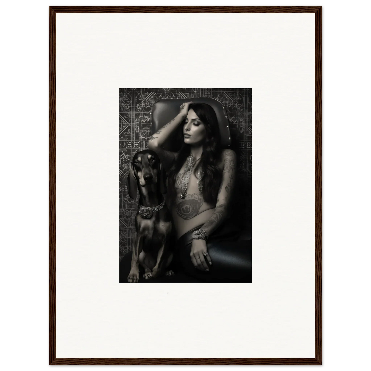 Black and white photograph of a woman posing with a dog.