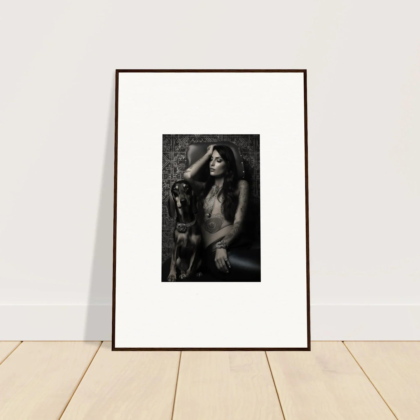Framed black and white photograph of a person with long hair posing alongside a dog.