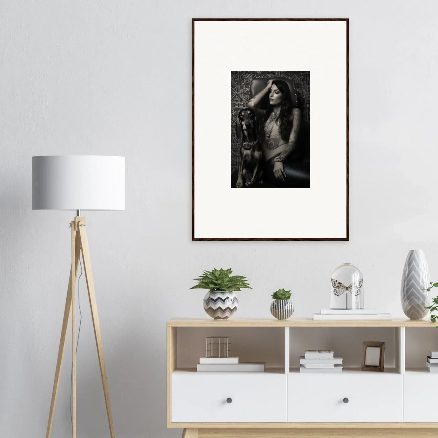 Framed black and white photograph of a person with long hair.