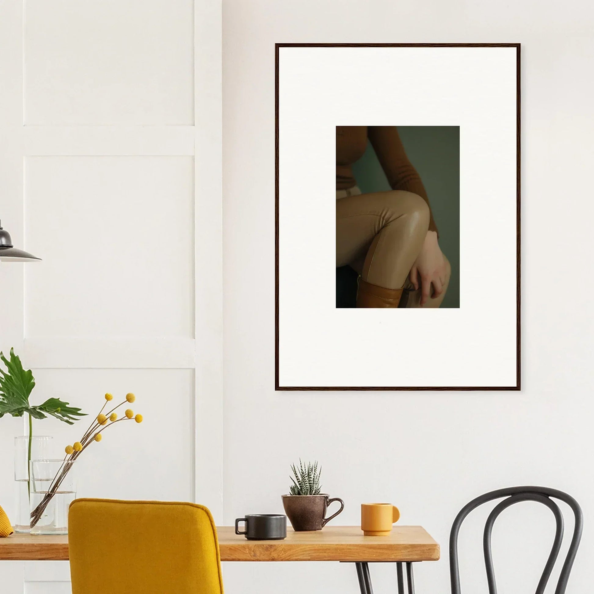 Framed photograph of a person’s bare shoulder and upper arm.