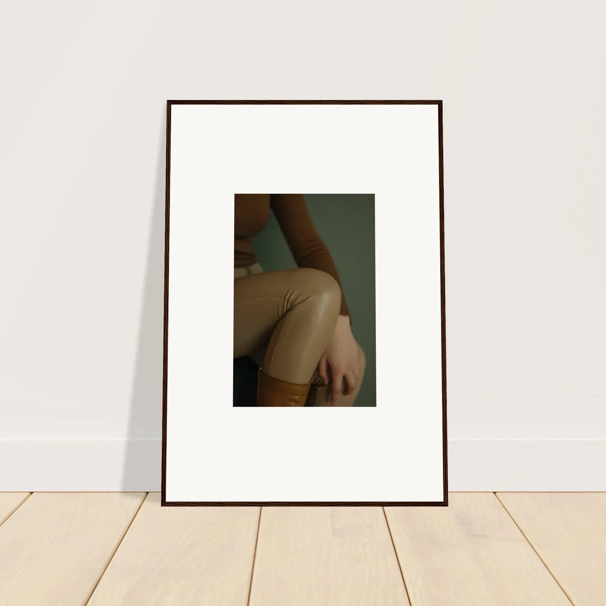 Framed photograph showing a close-up view of a person’s bare shoulder and upper arm.