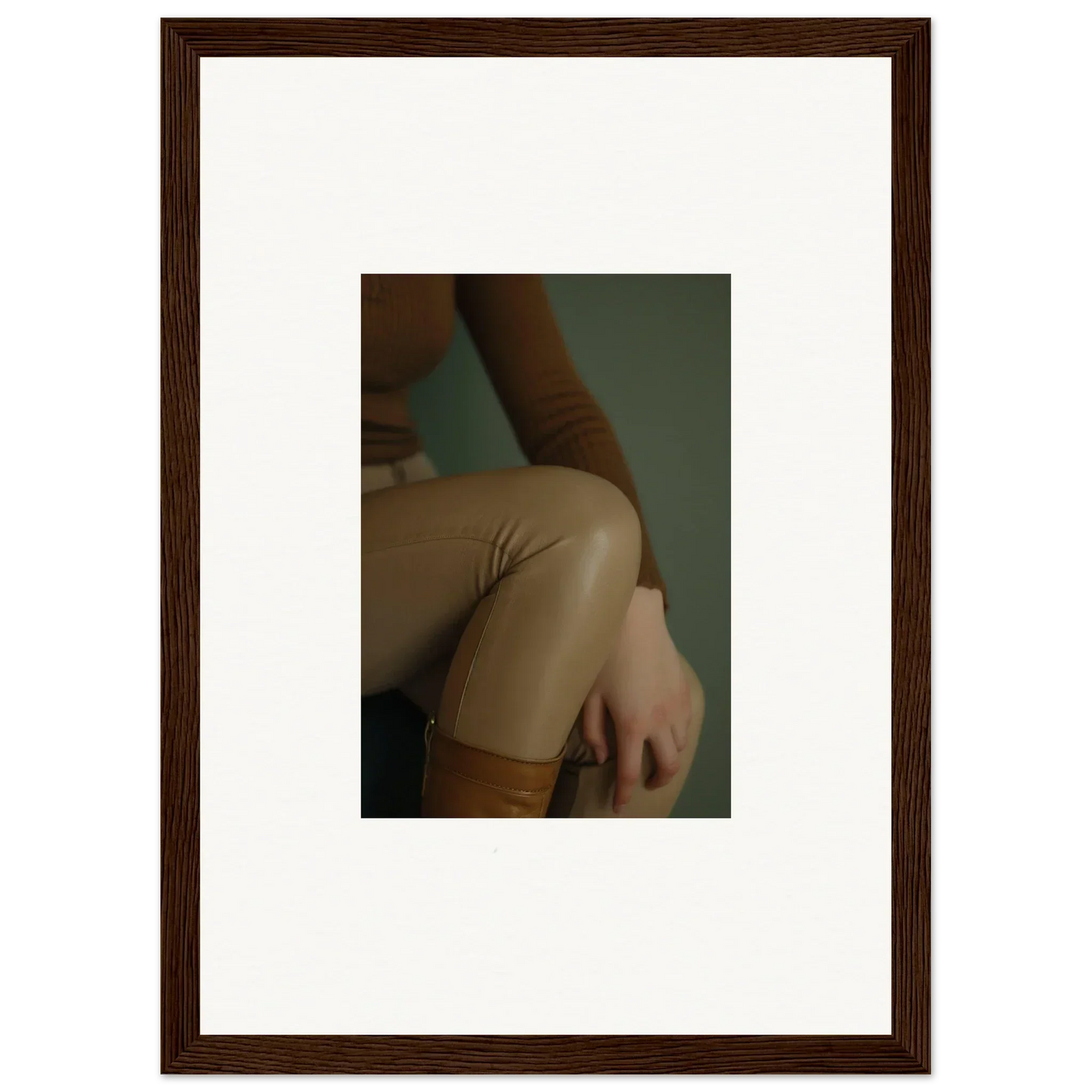 Framed photograph showing a close-up of a person’s shoulder and upper arm.