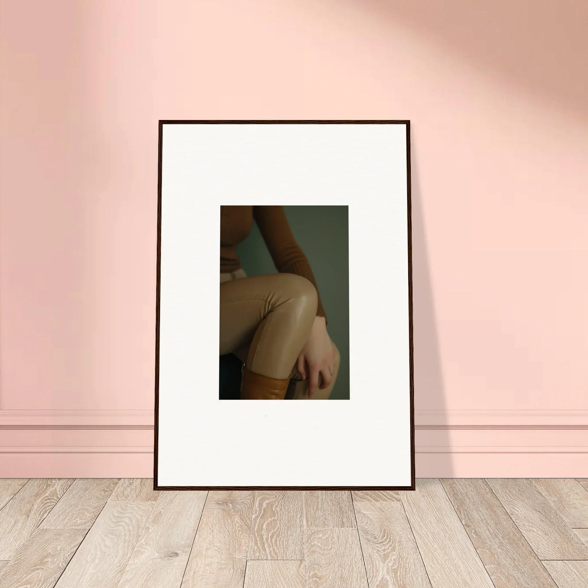 Framed photograph of a person’s bare shoulder and arm against a dark background.