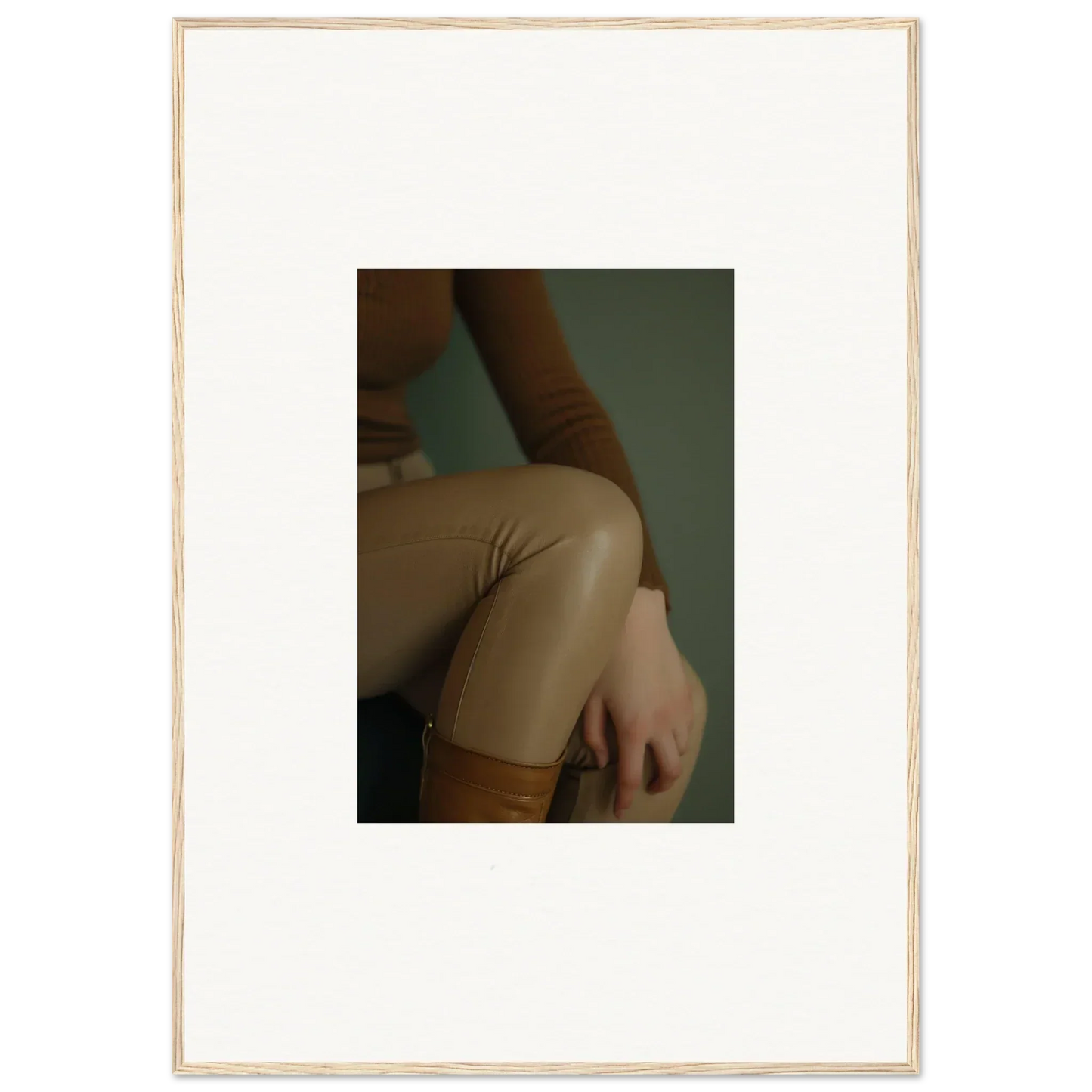 Close-up view of a person’s arm and torso wearing a beige or tan colored garment.