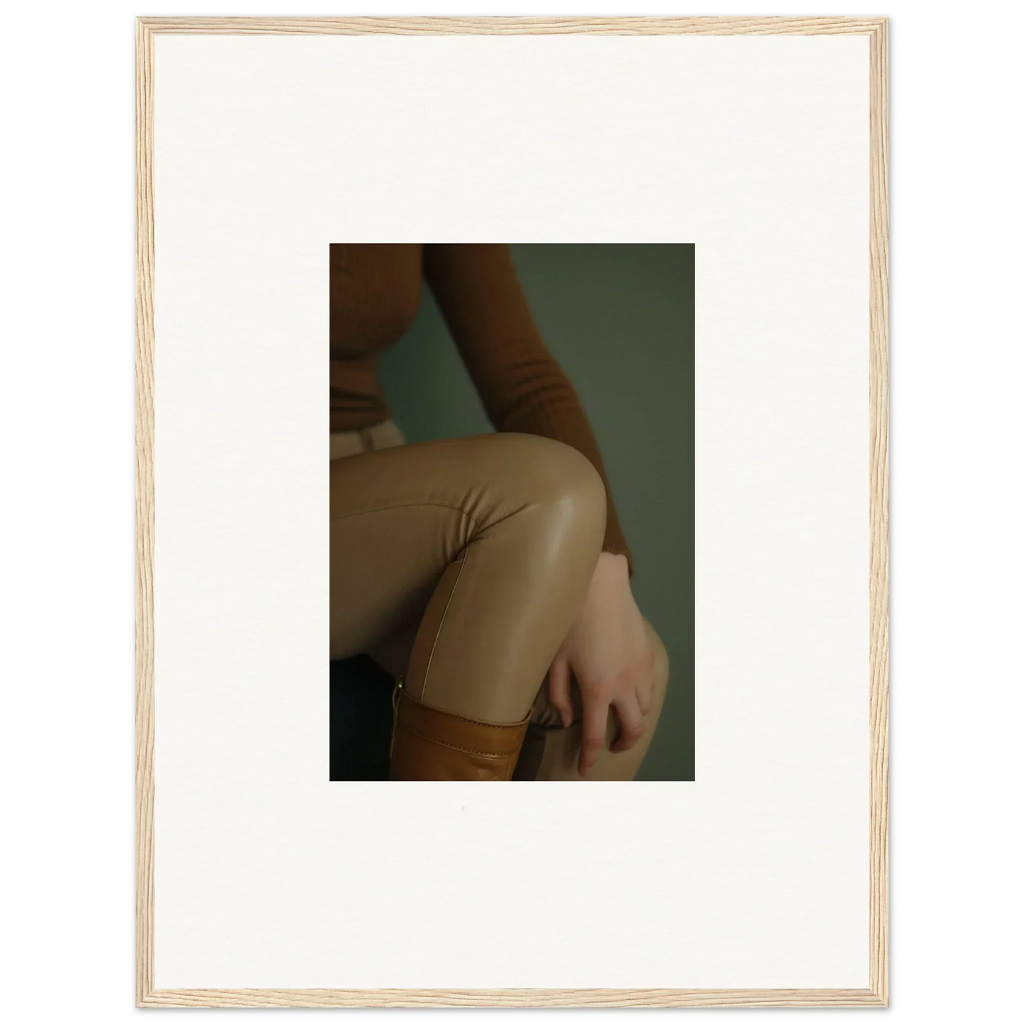 Close-up view of a person’s arm and torso wearing a beige or tan colored top.