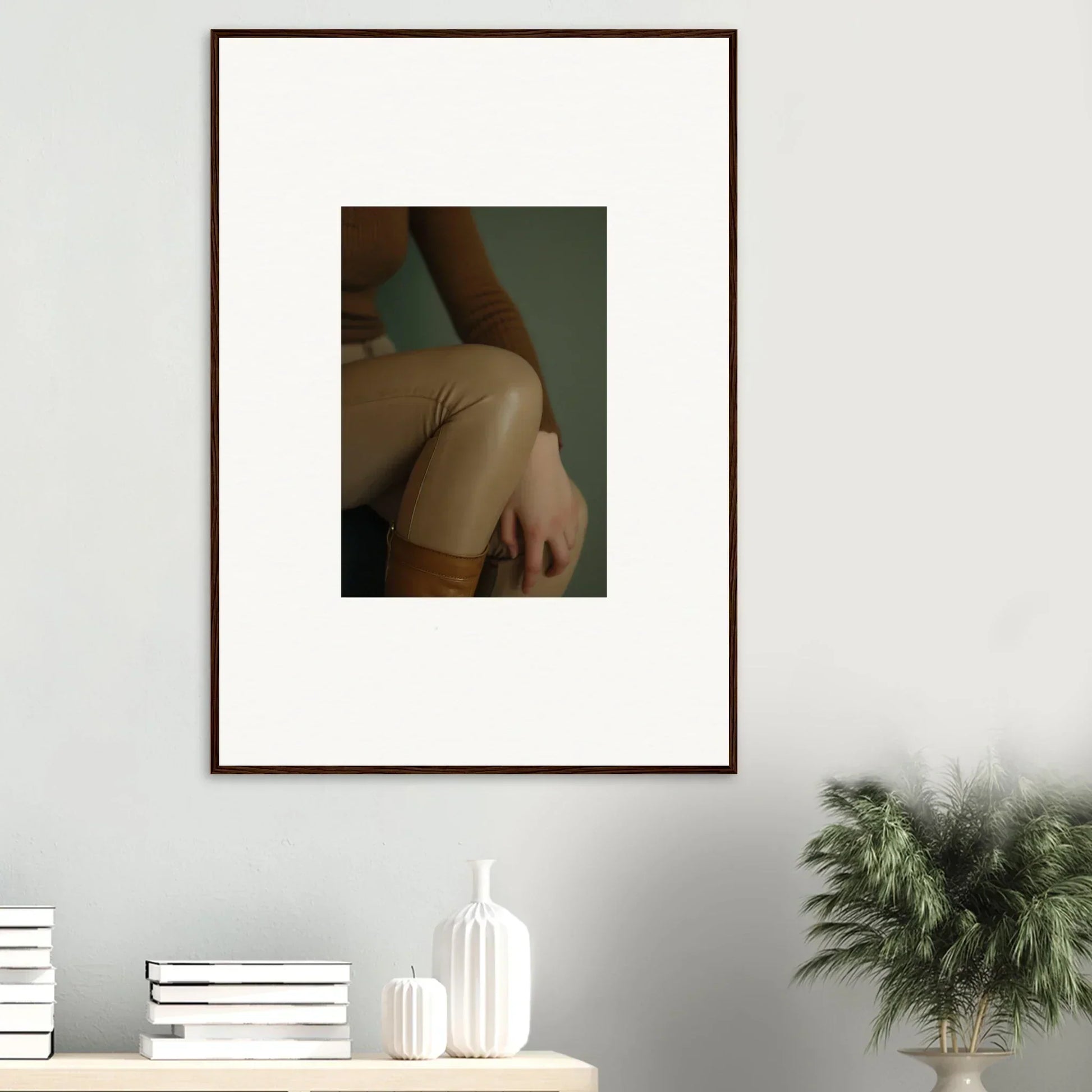 Framed photograph showing a close-up view of a person’s bare shoulder and arm.