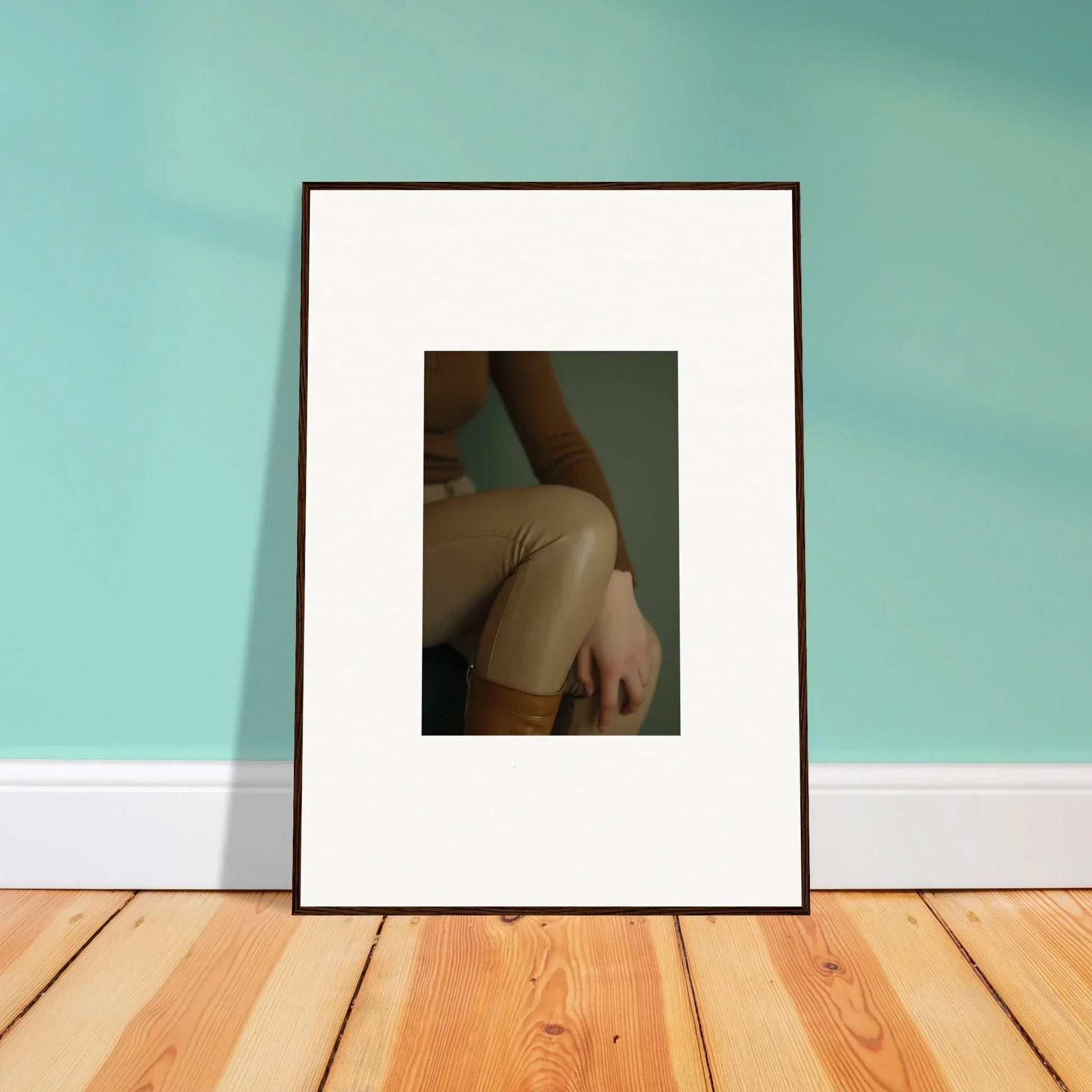 Framed photograph of a person’s bare shoulder and neck against a dark background.