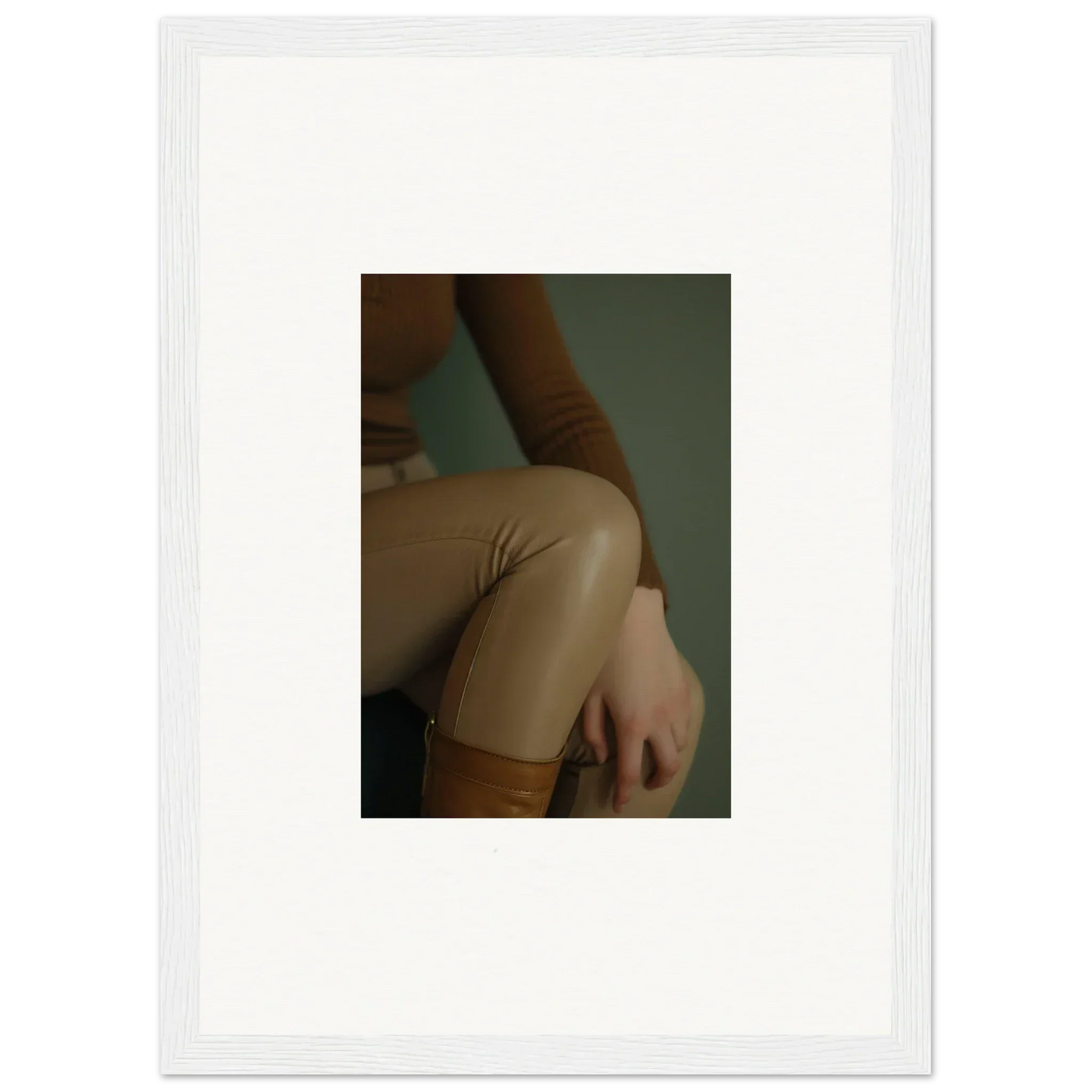 Close-up view of a person’s arm and torso wearing beige clothing.